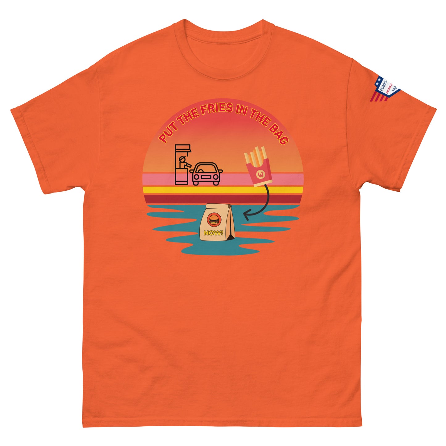 Front view of orange unisex T-shirt with "PUT THE FRIES IN THE BAG" epic drive-thru sunset meme, fries, bag and flag patch