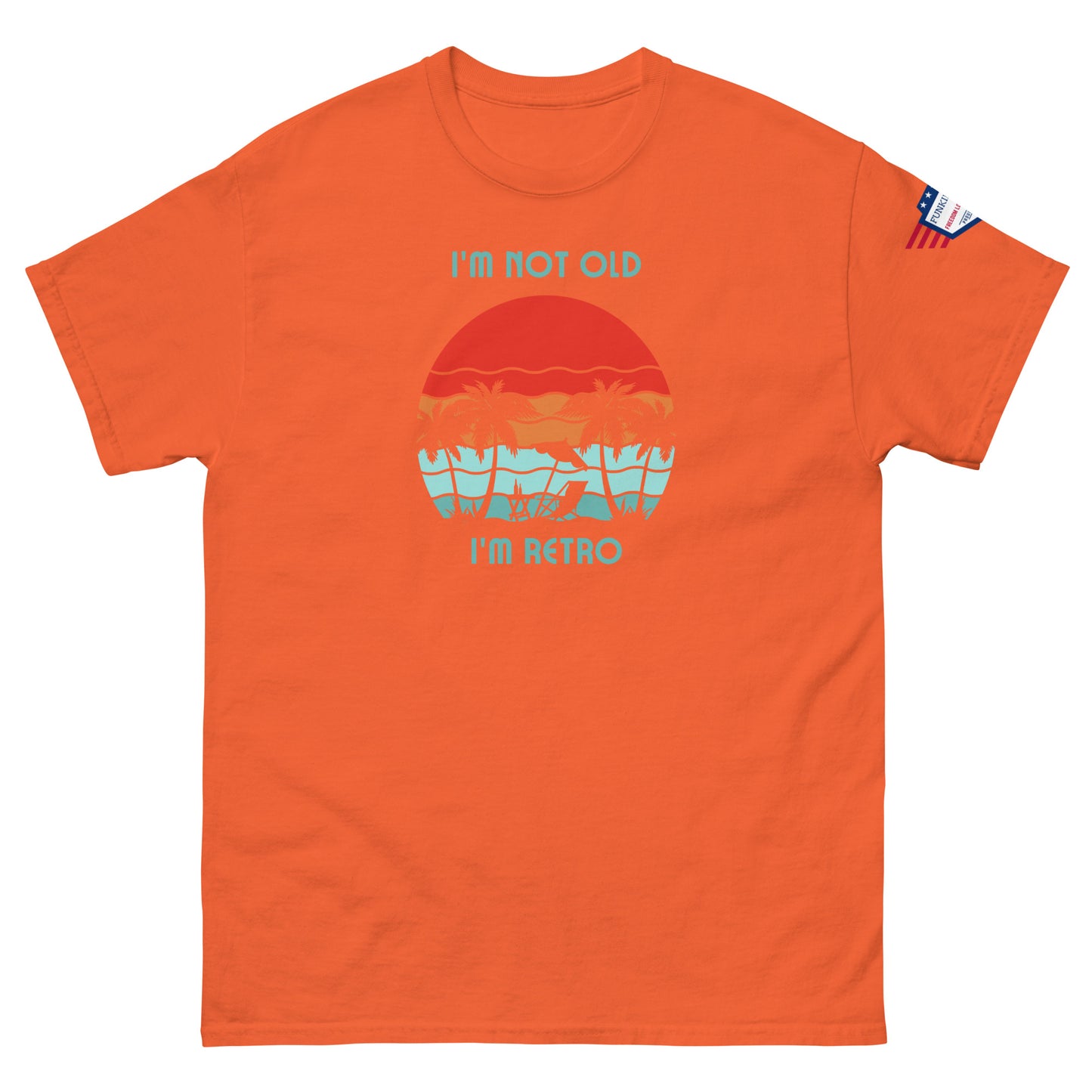 Front view of orange "I'm Not Old I'm Retro" unisex tee with fiery sunset palms and USA patch