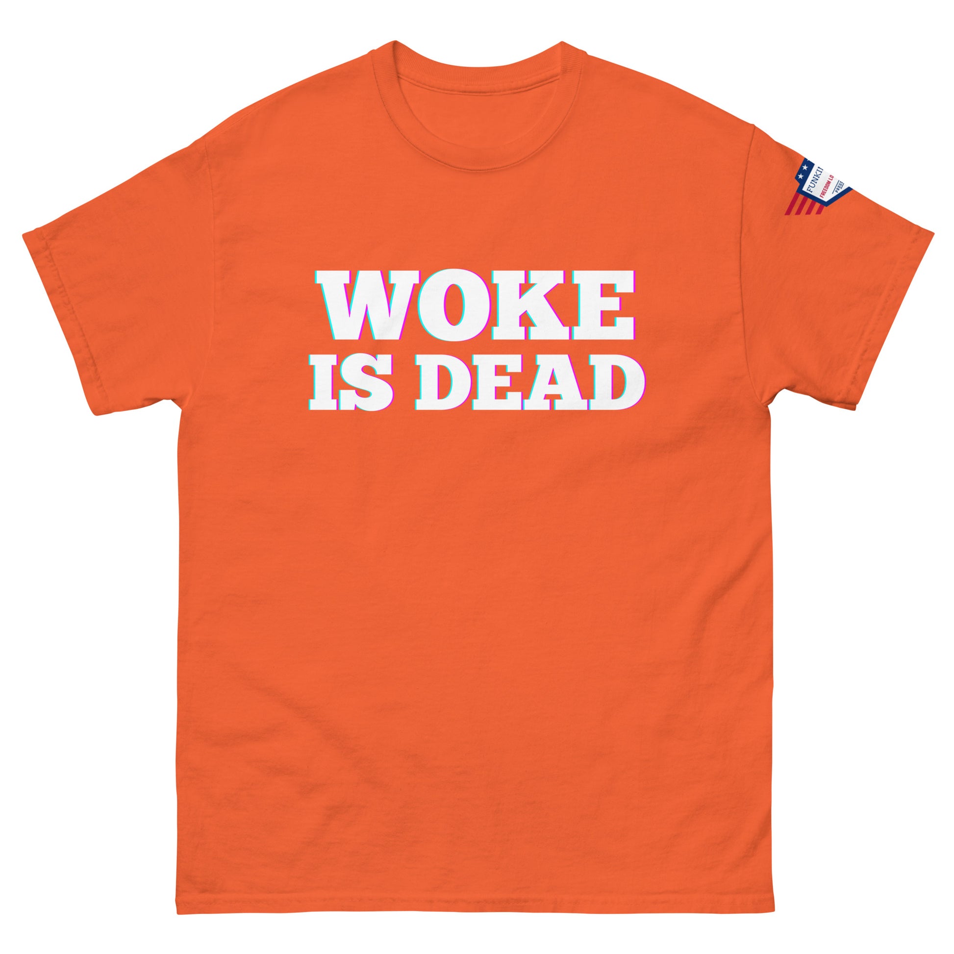 Front view of orange unisex tee blasting "WOKE IS DEAD" in glowing glitch letters, flag detail