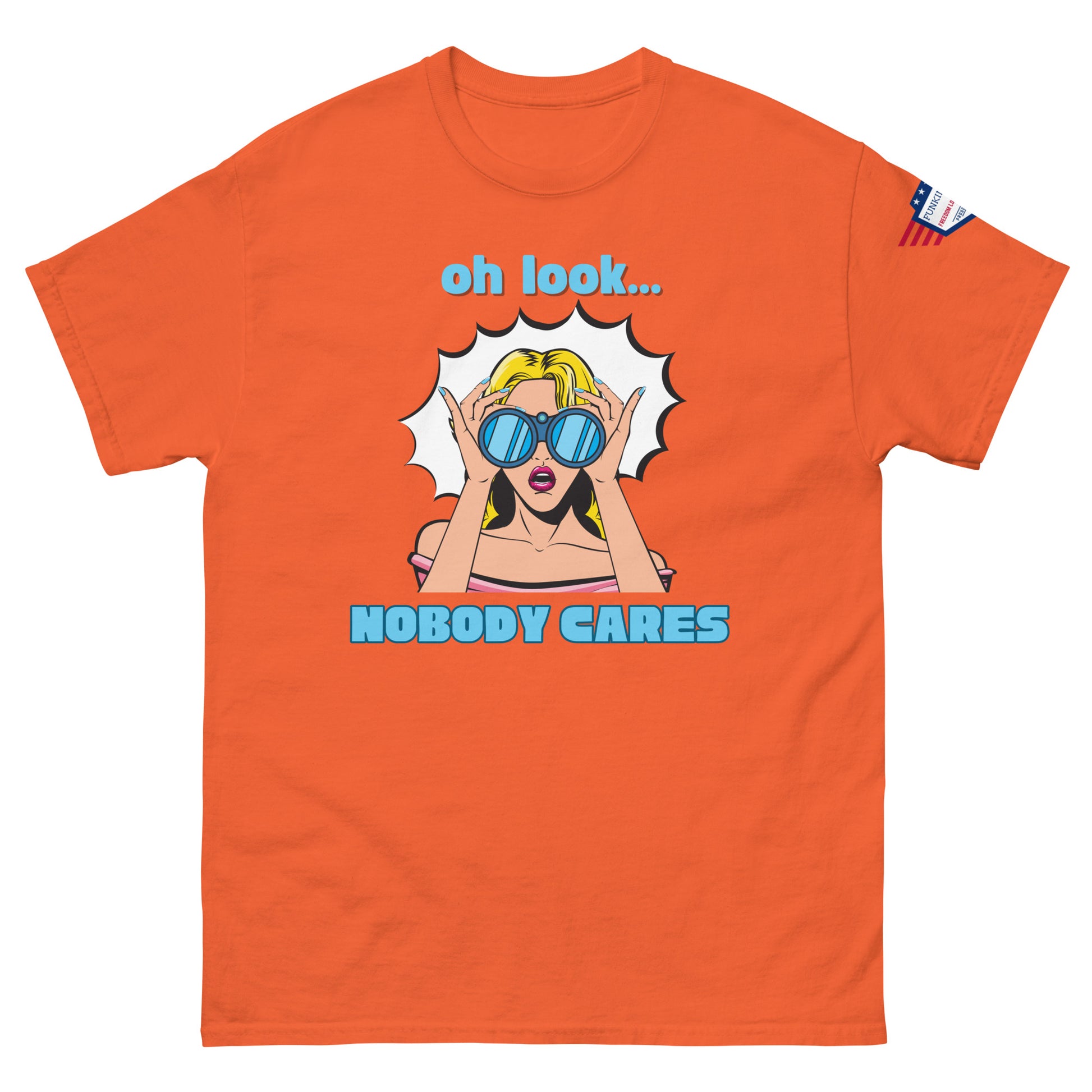 Front view of orange unisex tee dripping sarcasm via "oh look... NOBODY CARES" shades-wearing pop art, flag patch