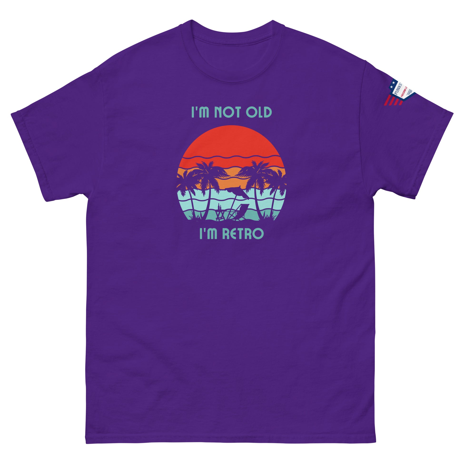 Front view of purple "I'm Not Old I'm Retro" t-shirt with palm tree sunset vibes and sleeve flag