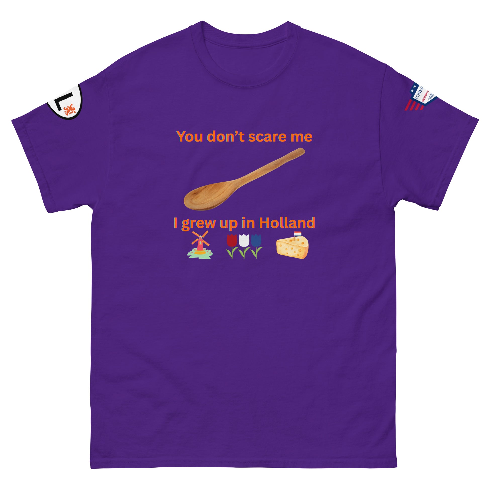 Front view of purple tee: orange "You don't scare me, I grew up in Holland", spoon, windmill, tulips & cheese graphics