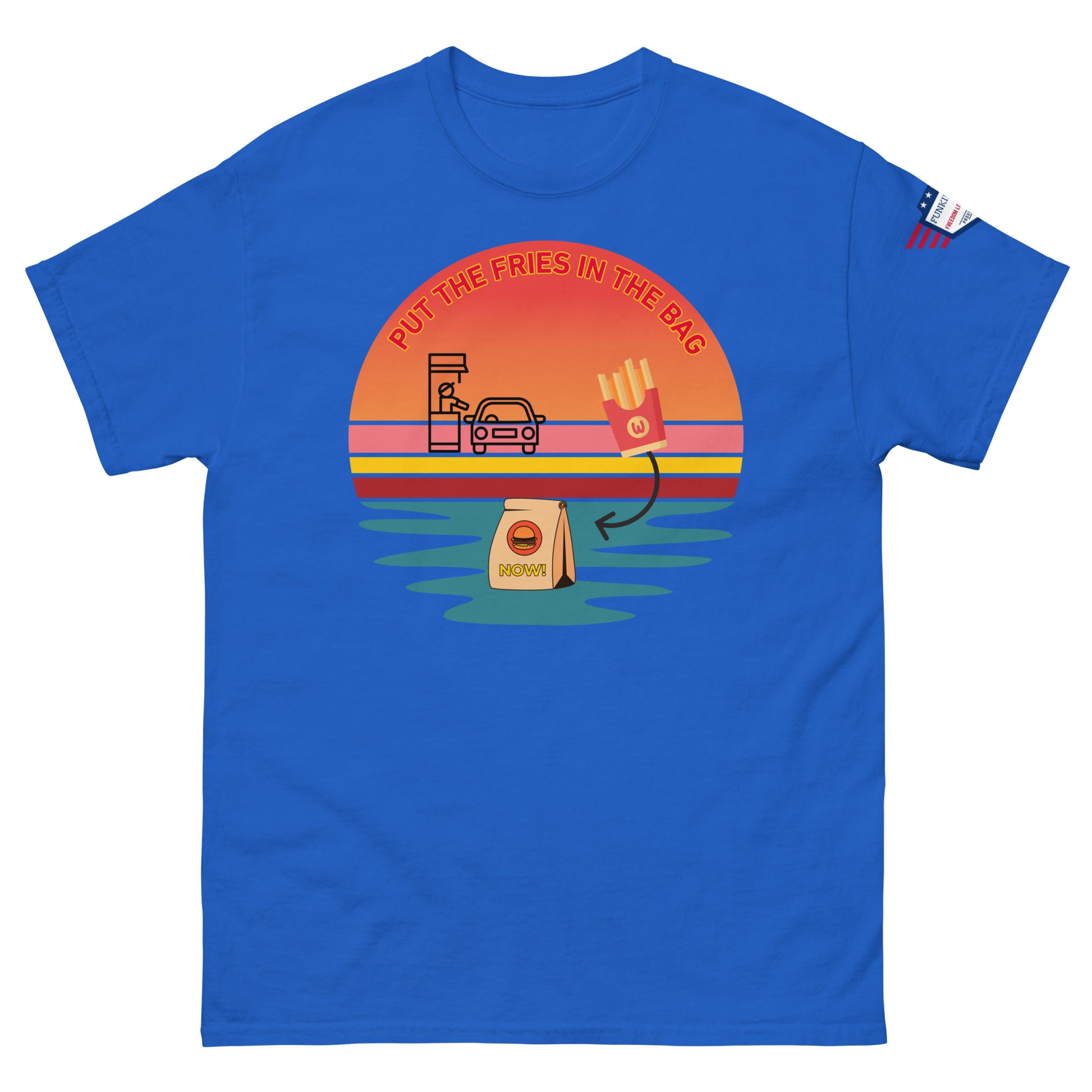 Front view of royal blue T-shirt sporting "PUT THE FRIES IN THE BAG" meme sunset drive-thru, fries, bag and US flag patch