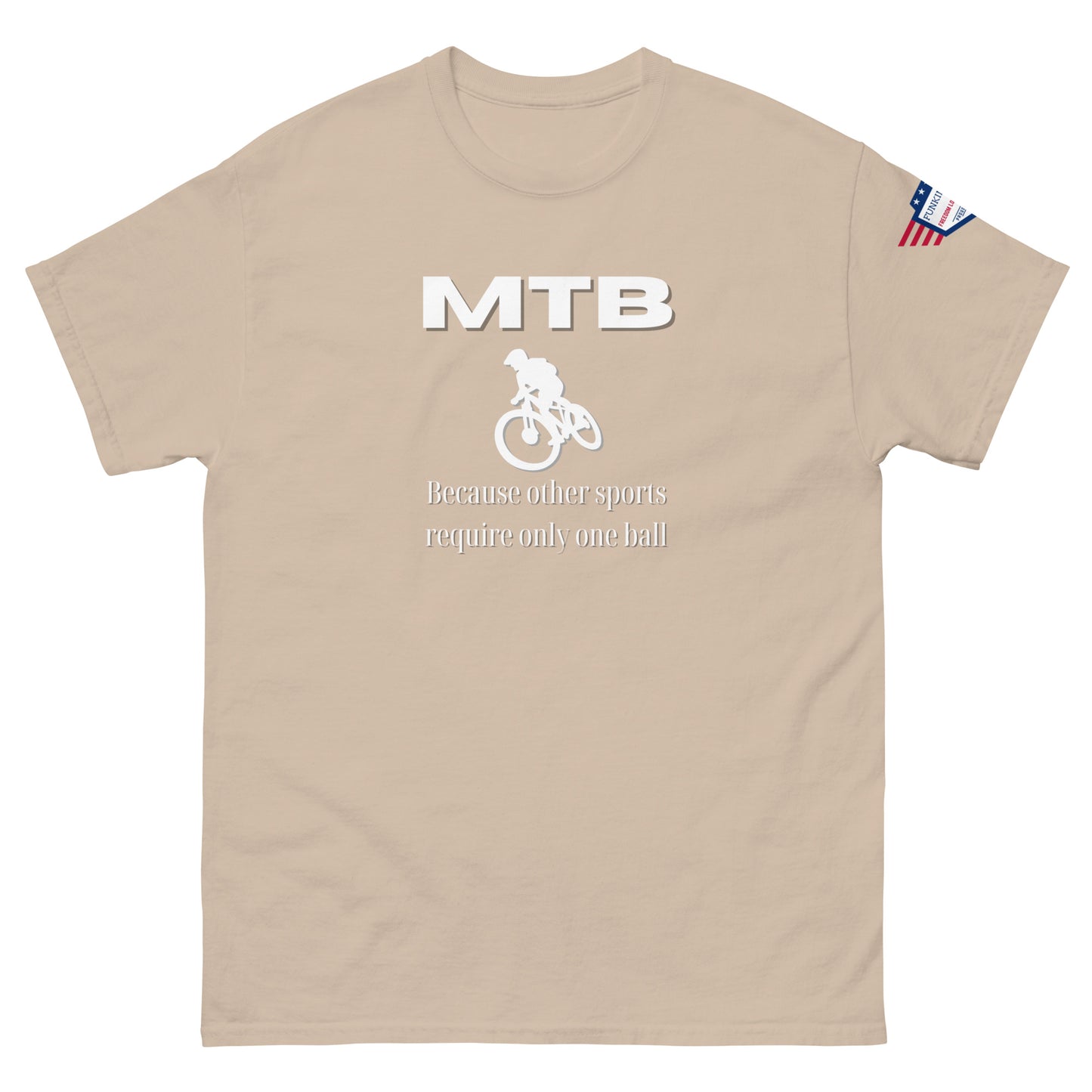 Front view of sand beige t-shirt showing white "MTB", rider graphic, "Because other sports require only one ball", flag sleeve patch