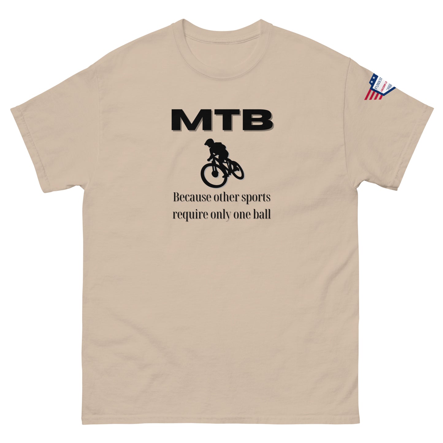 Sand beige t-shirt front: black "MTB" logo, cyclist graphic, "Because other sports require only one ball" jab