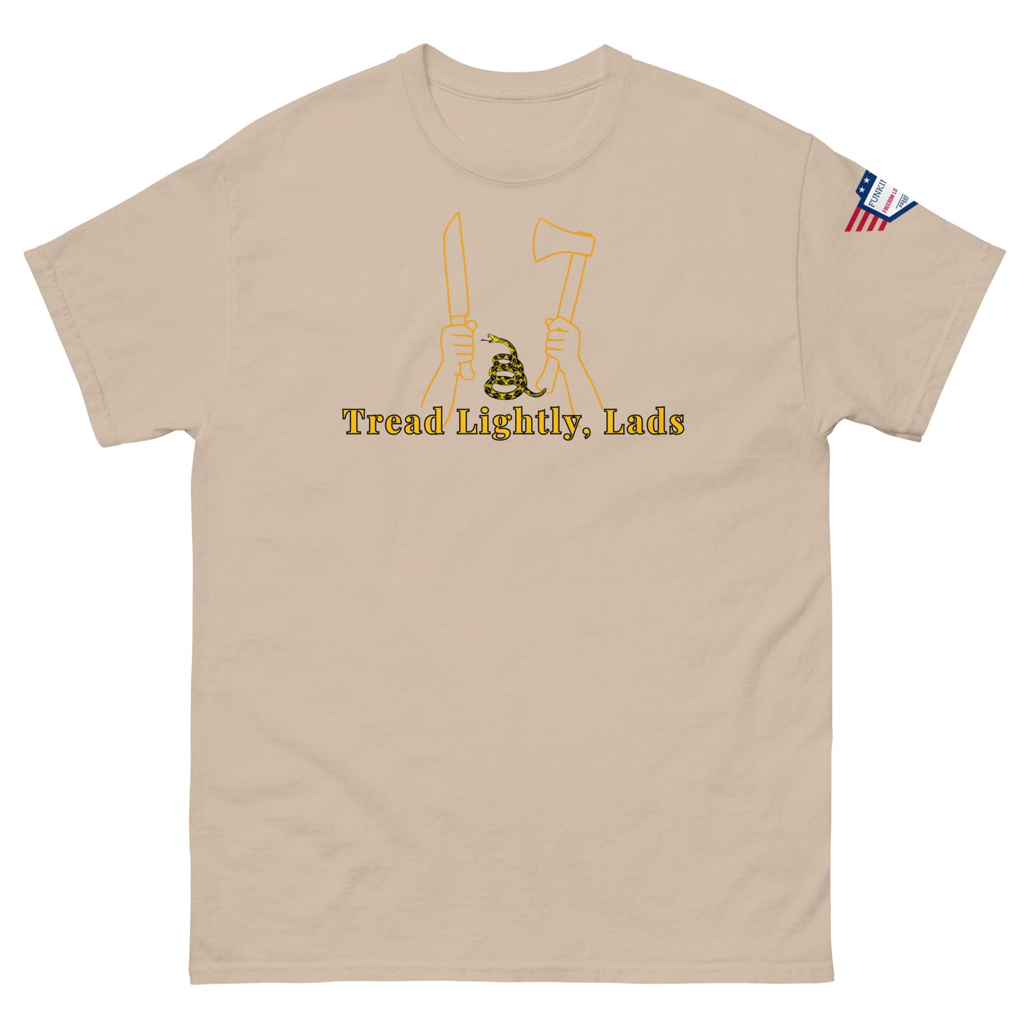 Front view of sand tan unisex tee showing "Tread Lightly, Lads" yellow print, armed hands & coiled snake design, US flag sleeve label