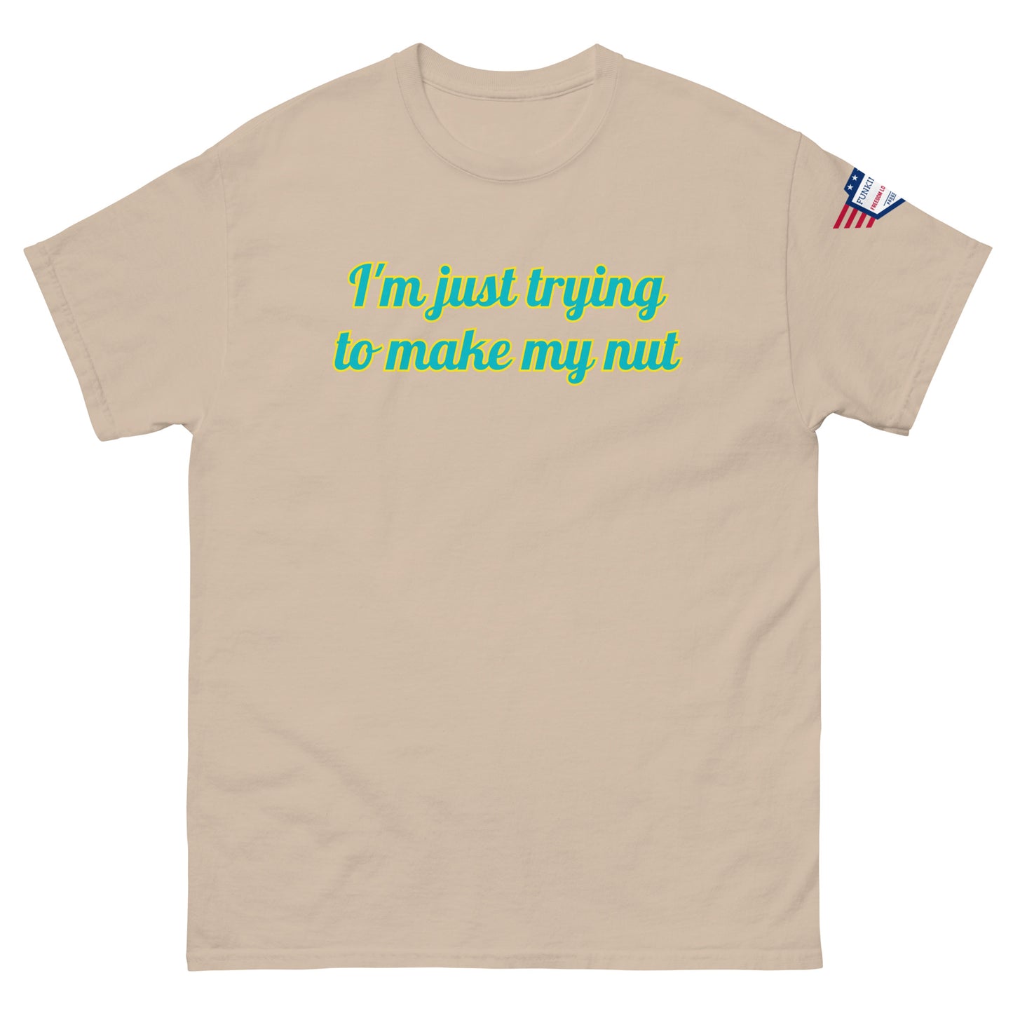 Front view of tan tee with "I'm just trying to make my nut" in teal script and US flag sleeve patch