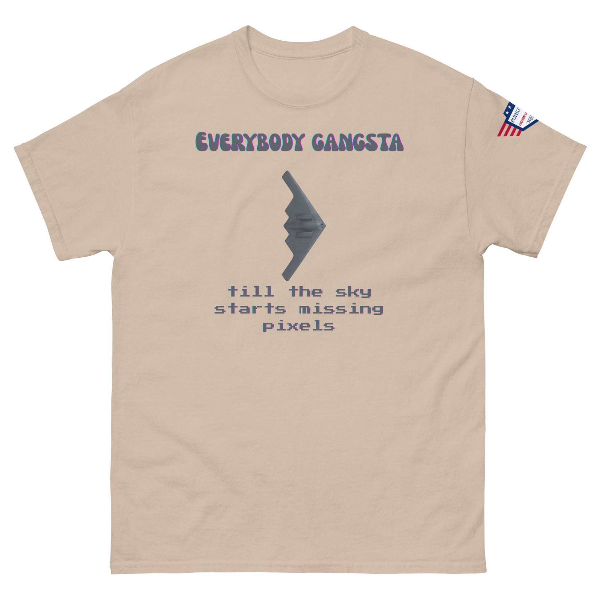 Front view of sand "Everybody Gangsta till the sky starts missing pixels" tee with stealth graphic and US flag sleeve