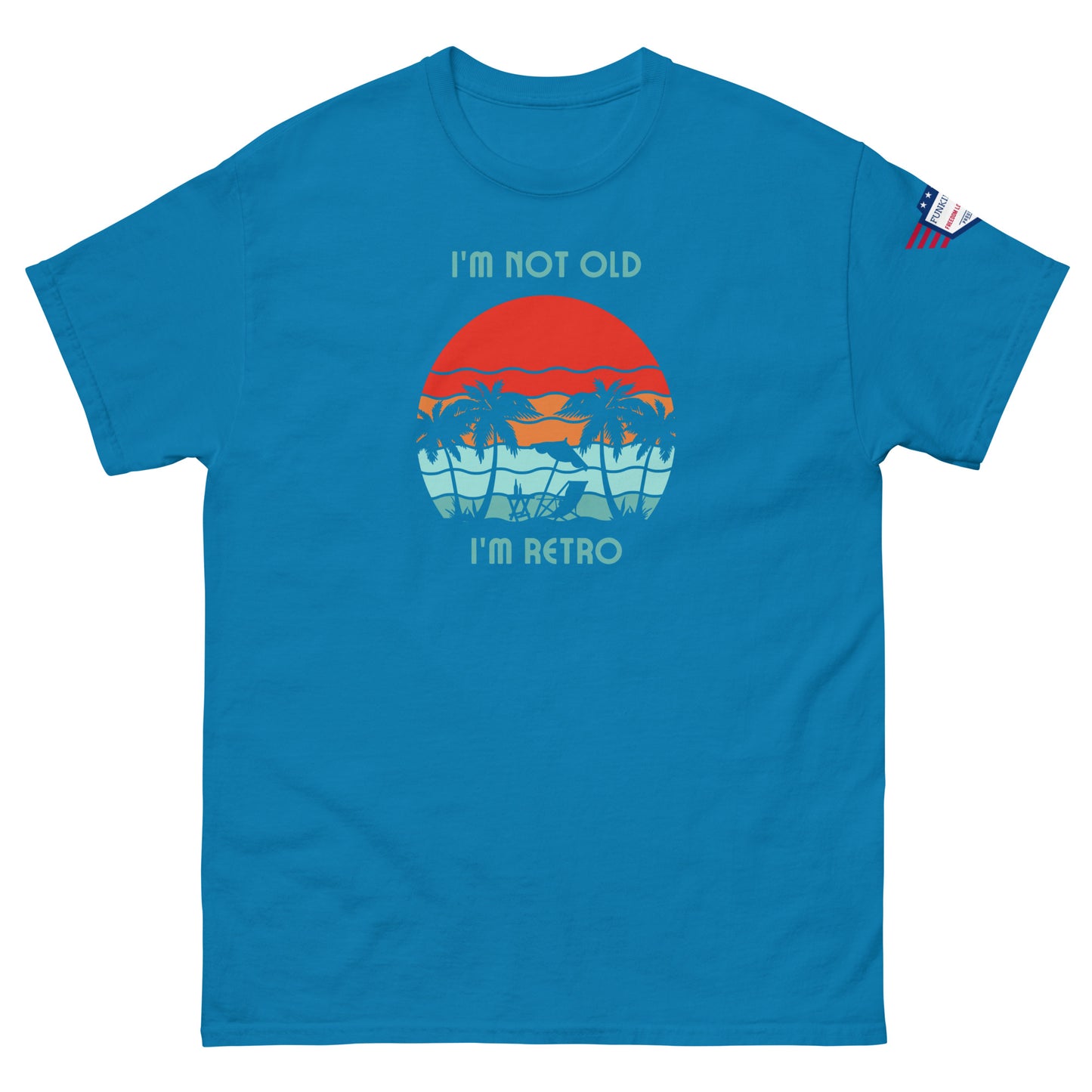 Front view of royal blue unisex t-shirt print: "I'm not old I'm retro" sunset and swaying palms