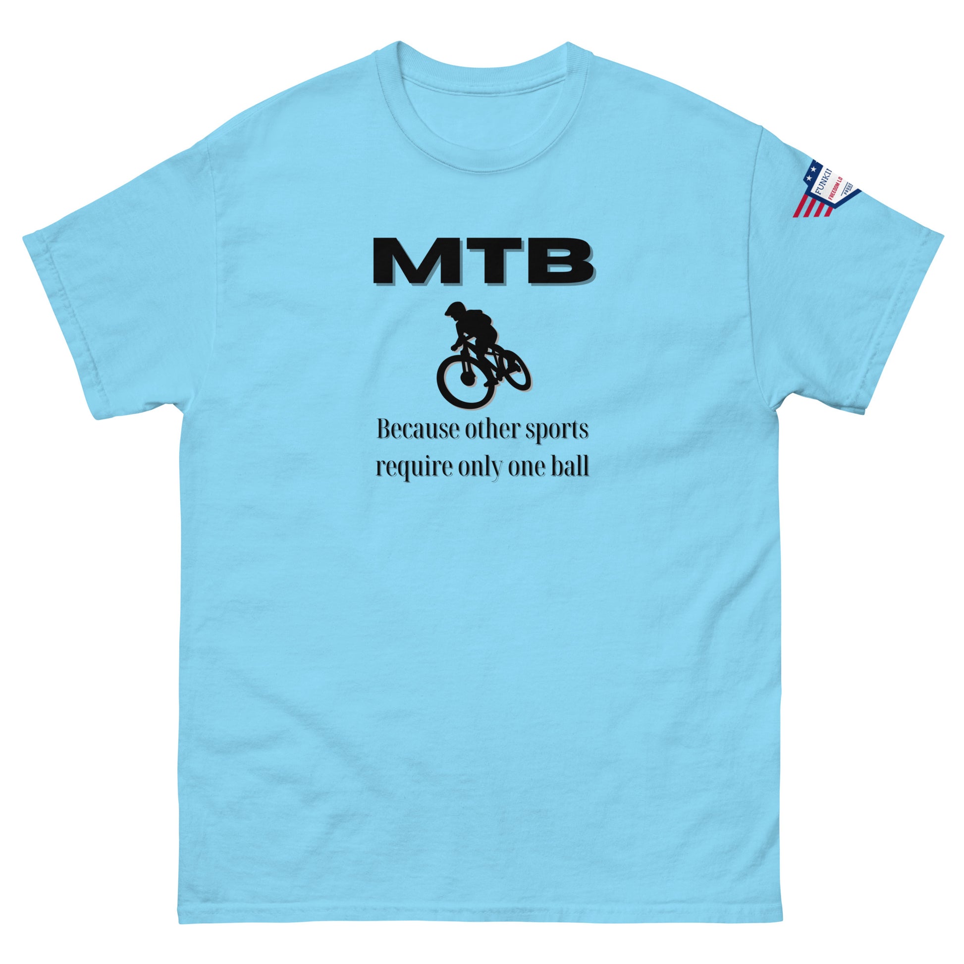 Front view of sky blue classic unisex tee with bold black "MTB" print, biker silhouette, and "Because other sports require only one ball" text