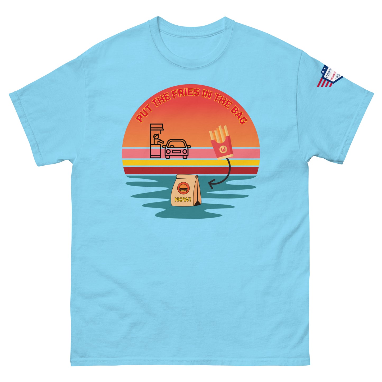 Front view of light blue unisex t-shirt with "PUT THE FRIES IN THE BAG" retro sunset drive-thru print