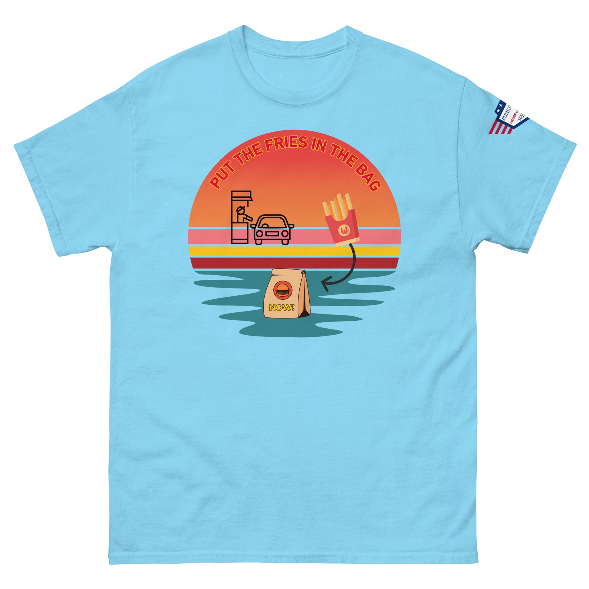 Front view of light blue unisex t-shirt with "PUT THE FRIES IN THE BAG" retro sunset drive-thru print