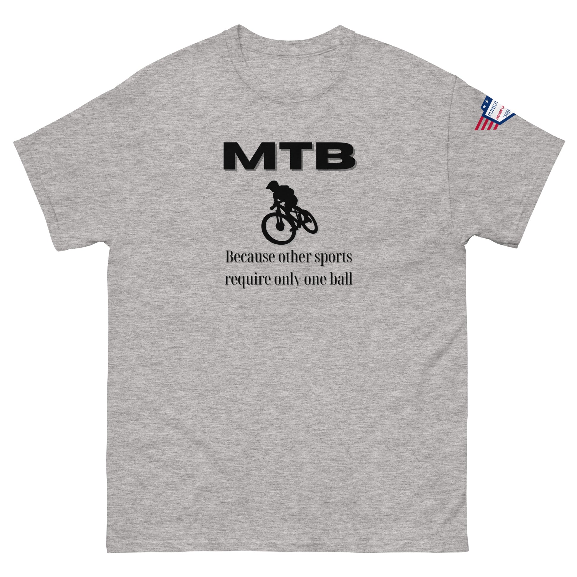 Front view of heather gray classic unisex tee with bold black "MTB" print, biker silhouette, and "Because other sports require only one ball" text