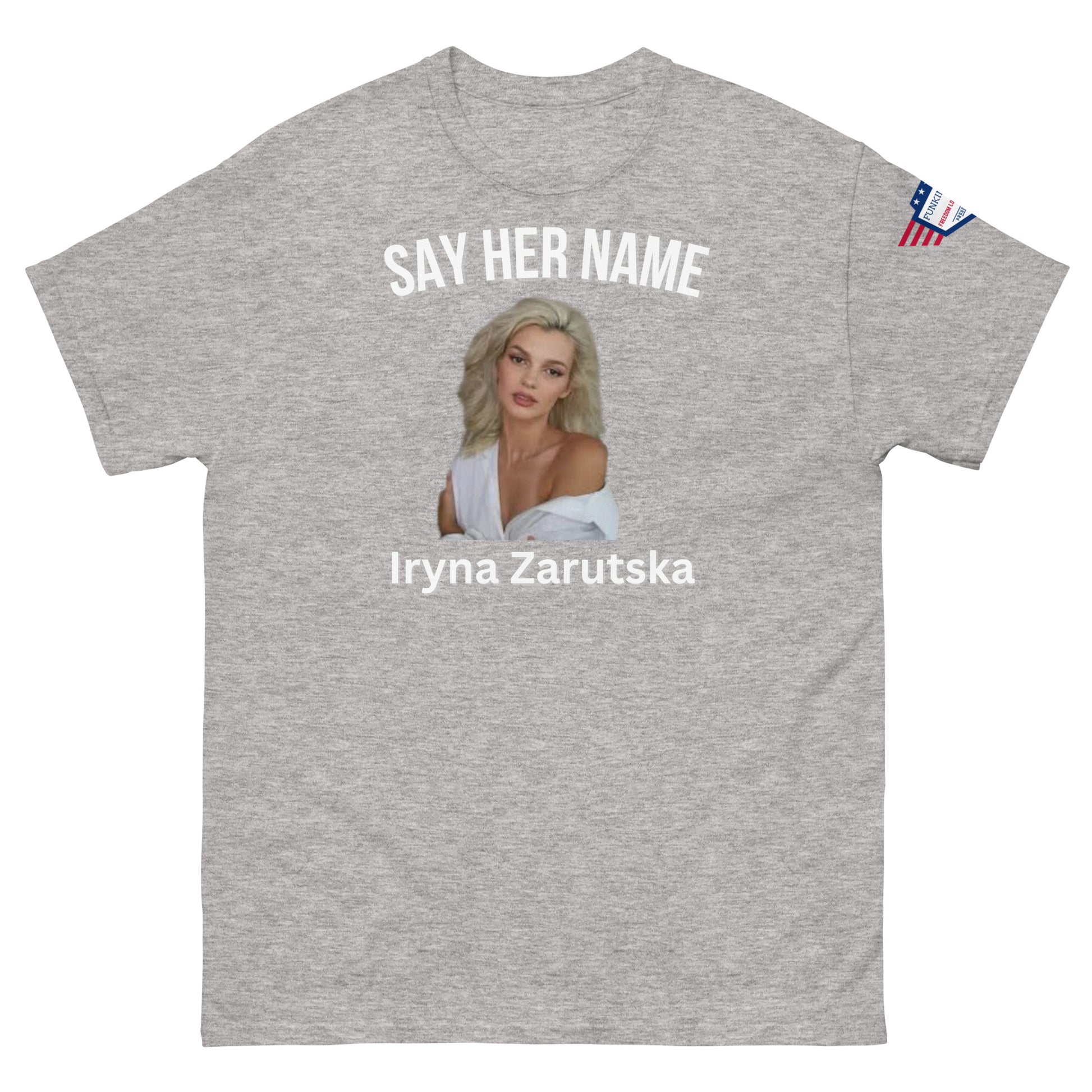 Front view of ash gray "SAY HER NAME Iryna Zarzutska" meme tee, USA flag on sleeve