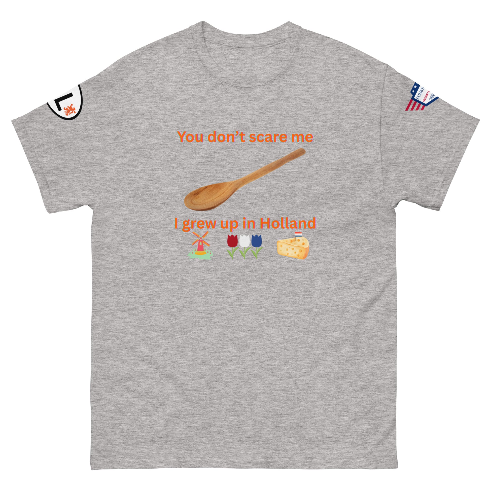 Front view of heather gray unisex tee featuring "You don't scare me I grew up in Holland" orange text, spoon, Dutch windmill, tulips, cheese icons, sleeve tags