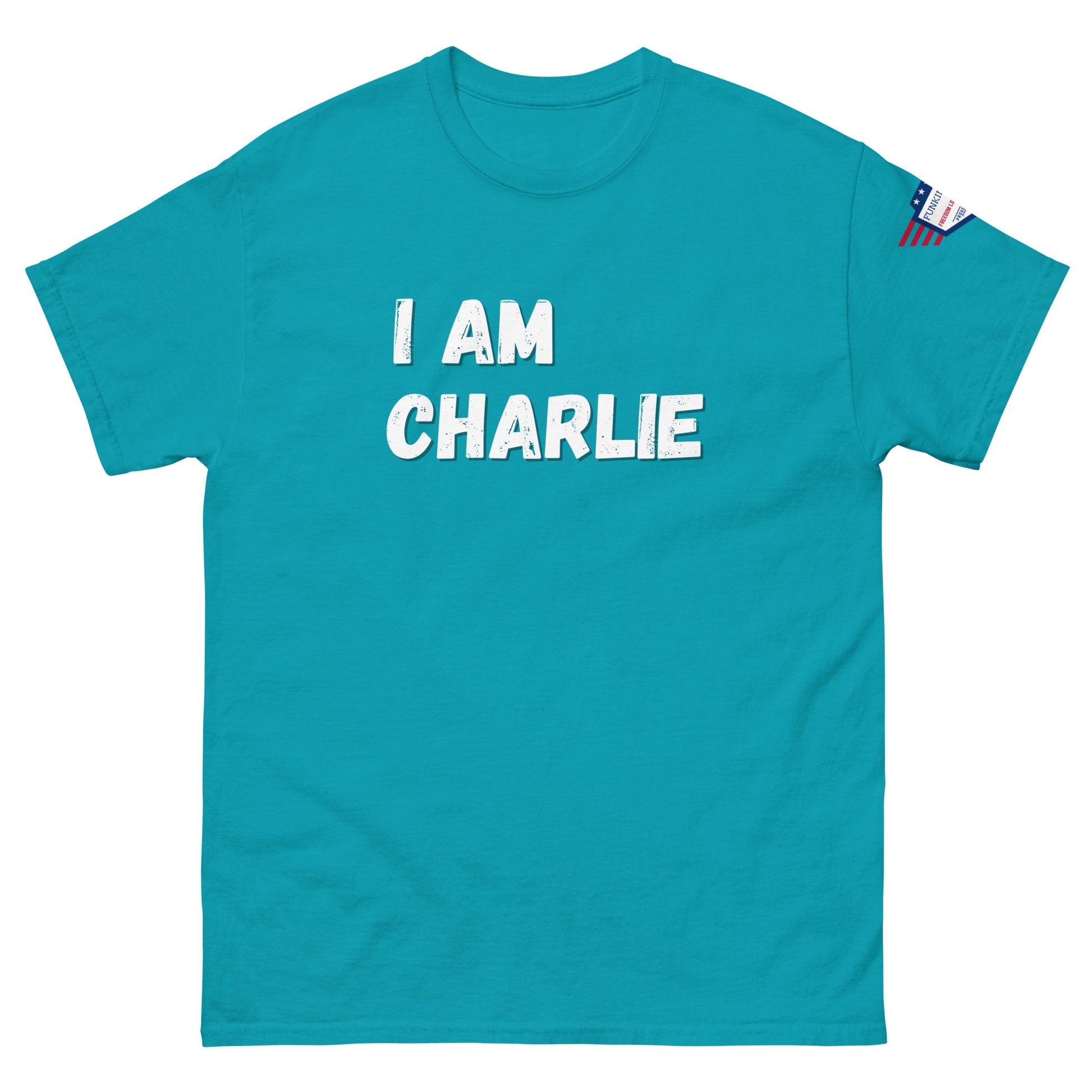 Front view of turquoise unisex tee with bold white "I AM CHARLIE" graphic and USA flag sleeve patch