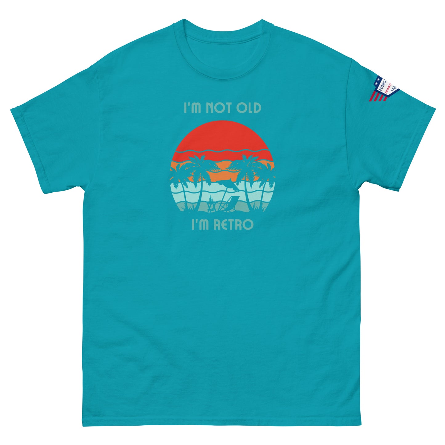 Front view of turquoise unisex t-shirt with "I'm not old I'm retro" red sun palm beach graphic