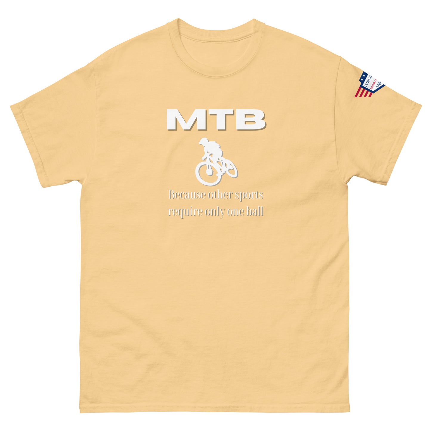 Front view of tan unisex tee with white "MTB" bold print, rider icon, "Because other sports require only one ball", US flag sleeve patch