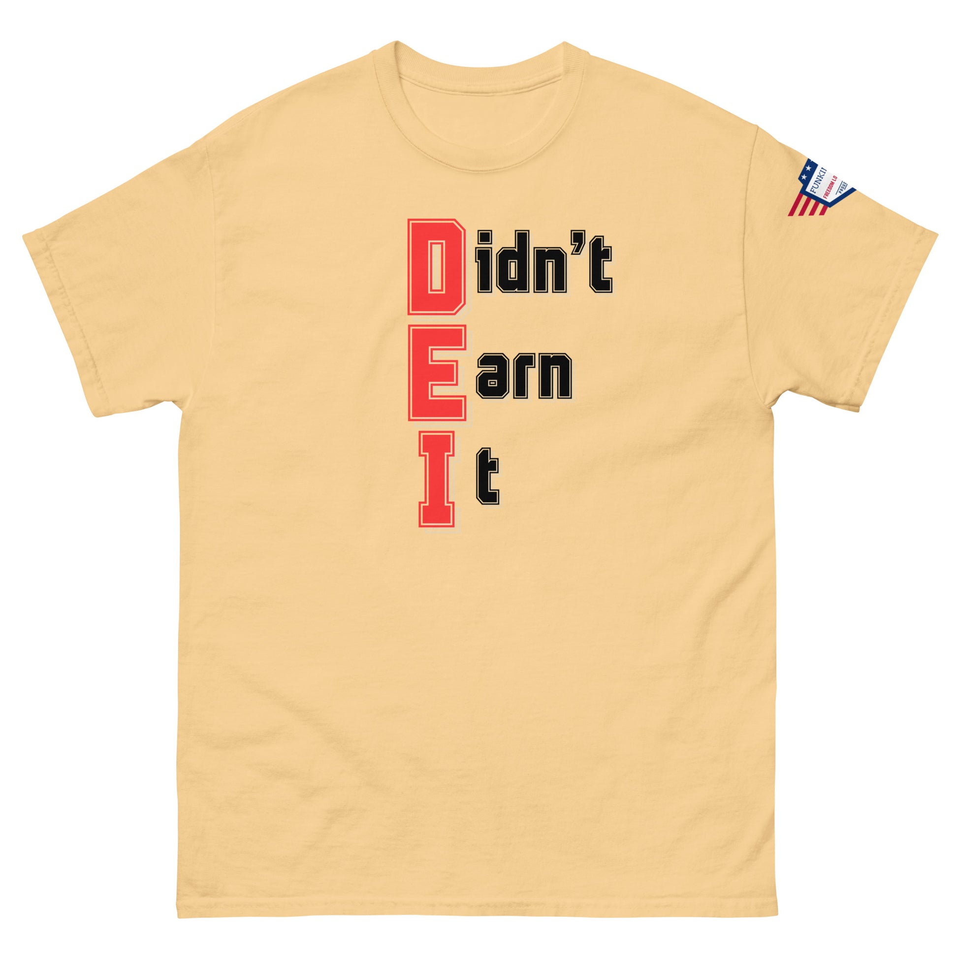 Front view of sand beige unisex t-shirt showing vertical "Didn't Earn It" graphic in red-outlined black, small USA flag patch