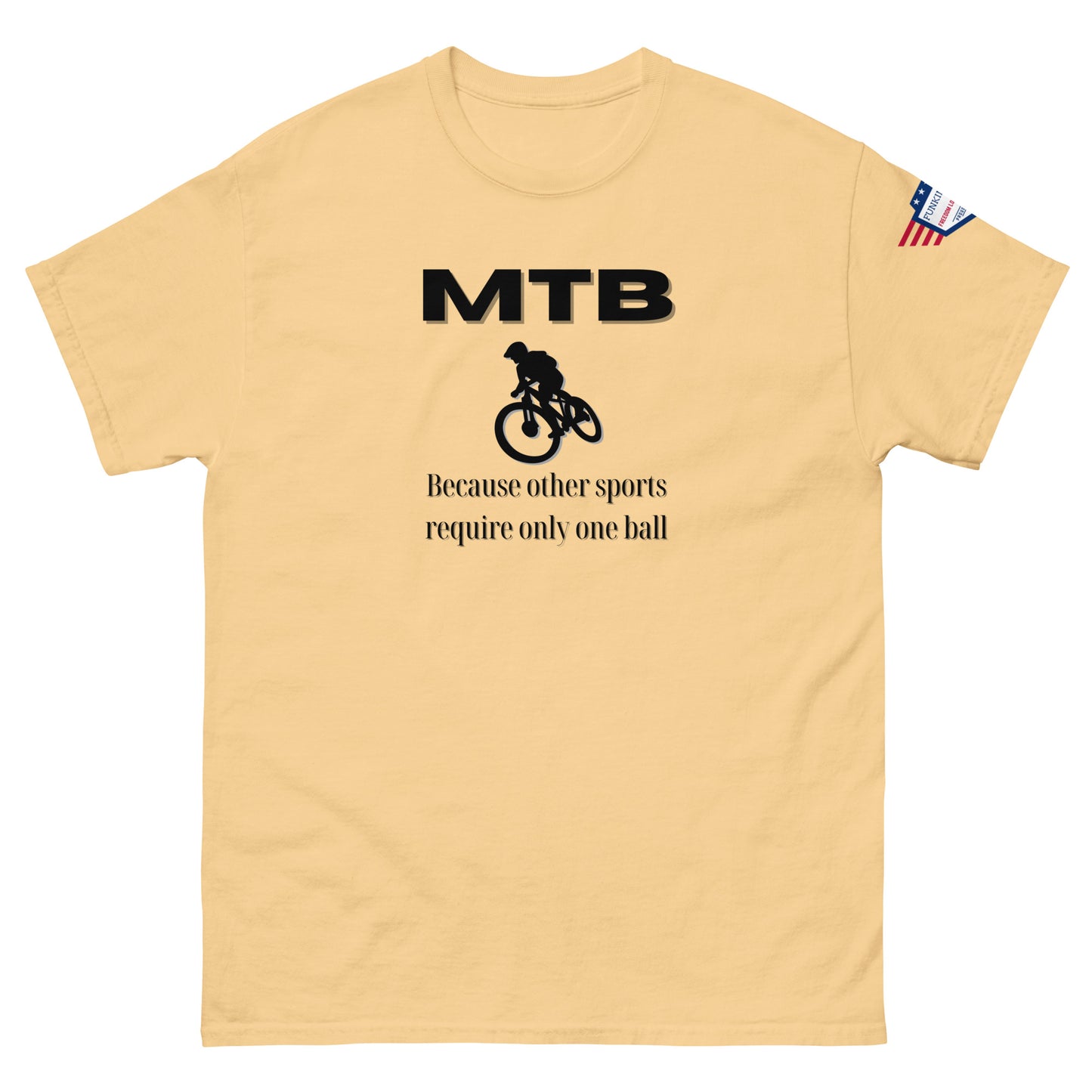 Front view of sand beige classic unisex tee with bold black "MTB" print, biker silhouette, and "Because other sports require only one ball" text