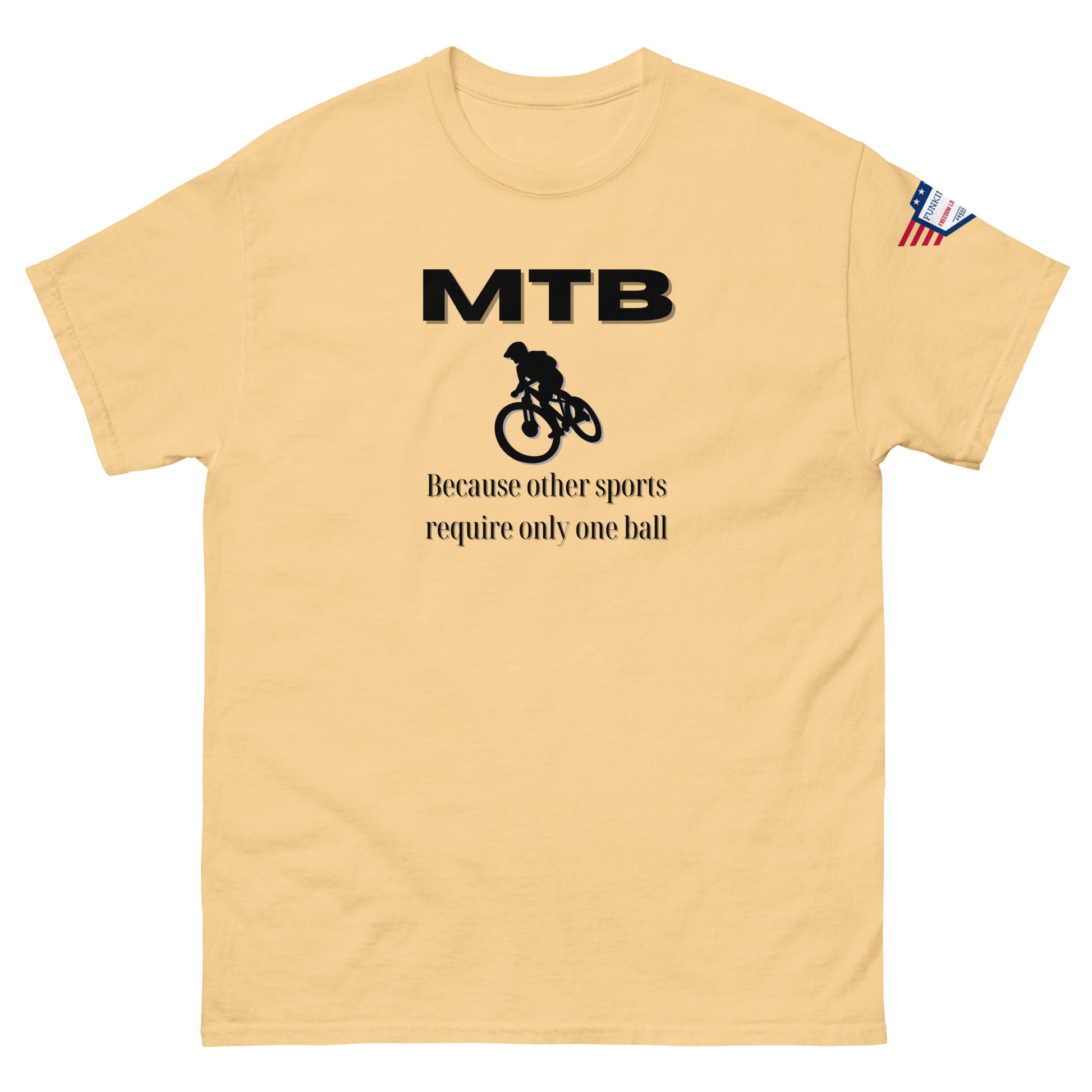 Front view of sand beige classic unisex tee with bold black "MTB" print, biker silhouette, and "Because other sports require only one ball" text