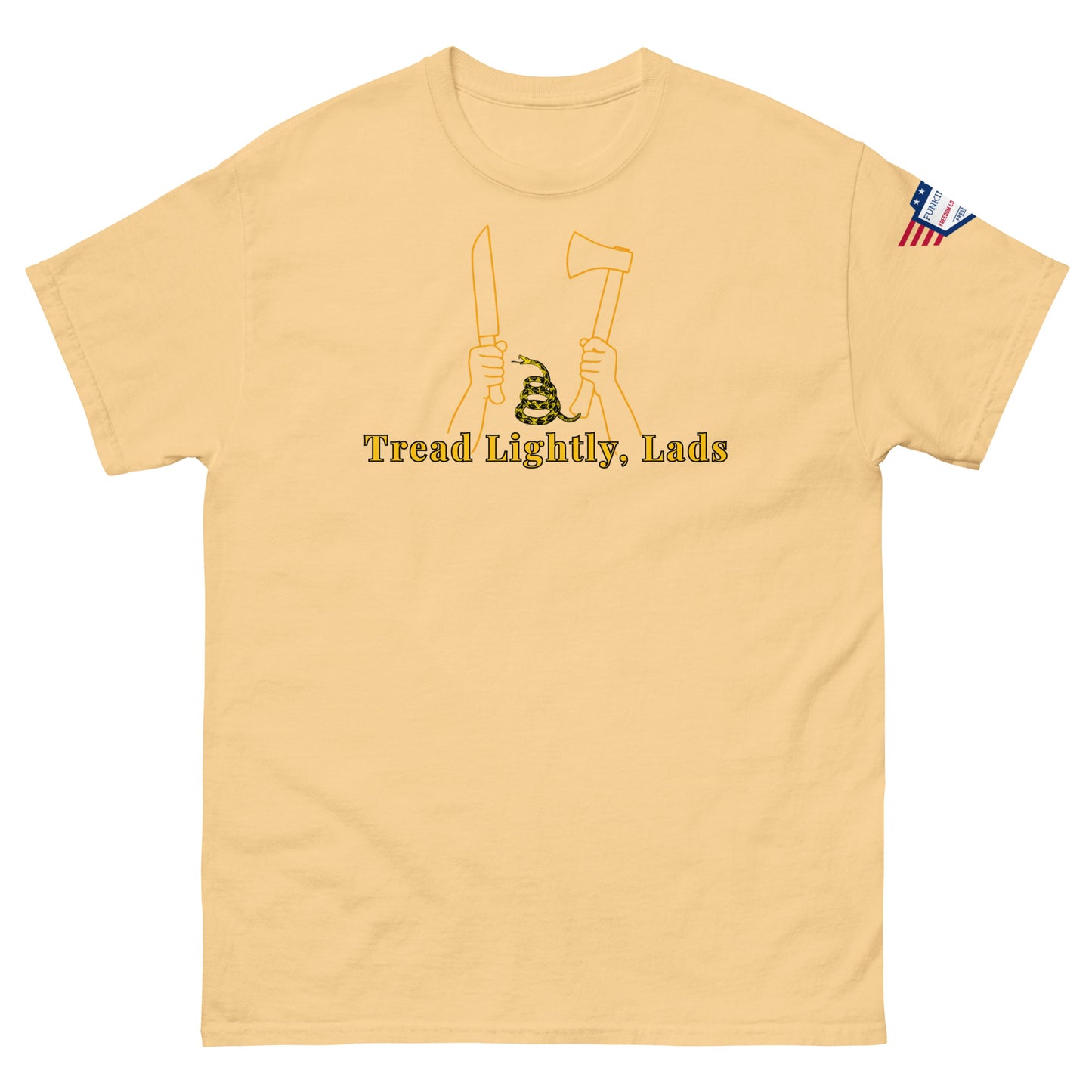 Front sand tan unisex tee with yellow "Tread Lightly, Lads" print, hands wielding knife & axe over snake, small US flag patch