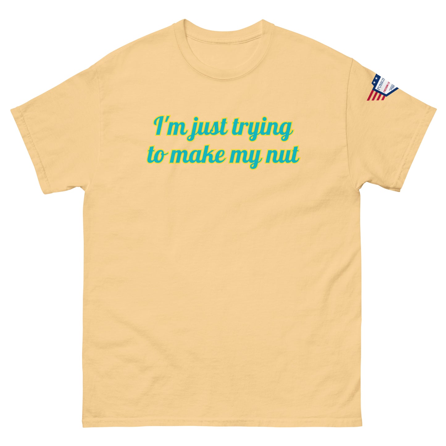 Front view of charcoal gray unisex tee with "I'm just trying to make my nut" in teal-yellow cursive print, US flag sleeve patch
