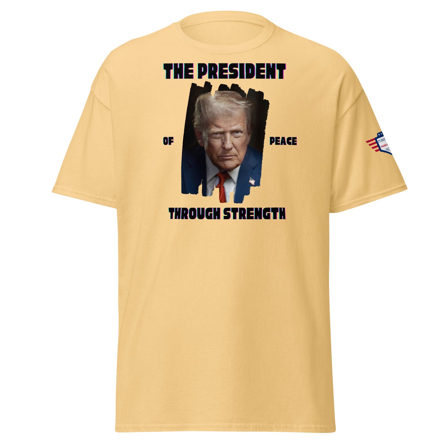 Front view of light yellow tee with bold "THE PRESIDENT OF PEACE THROUGH STRENGTH" text and splattered Trump portrait, flag sleeve patch