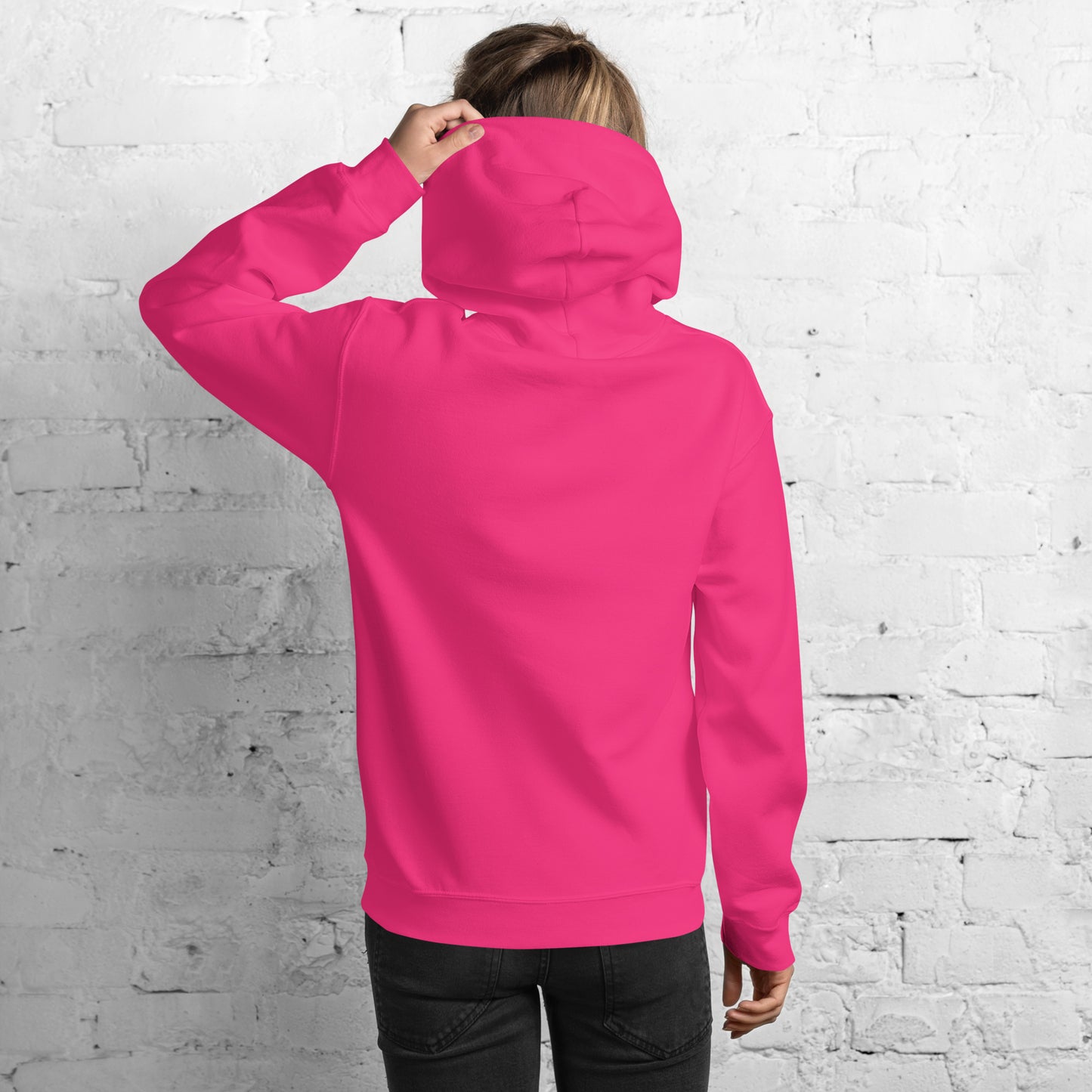Close-up front on model in hot pink hoodie, white "VIBING SOLO TODAY" embroidery popping