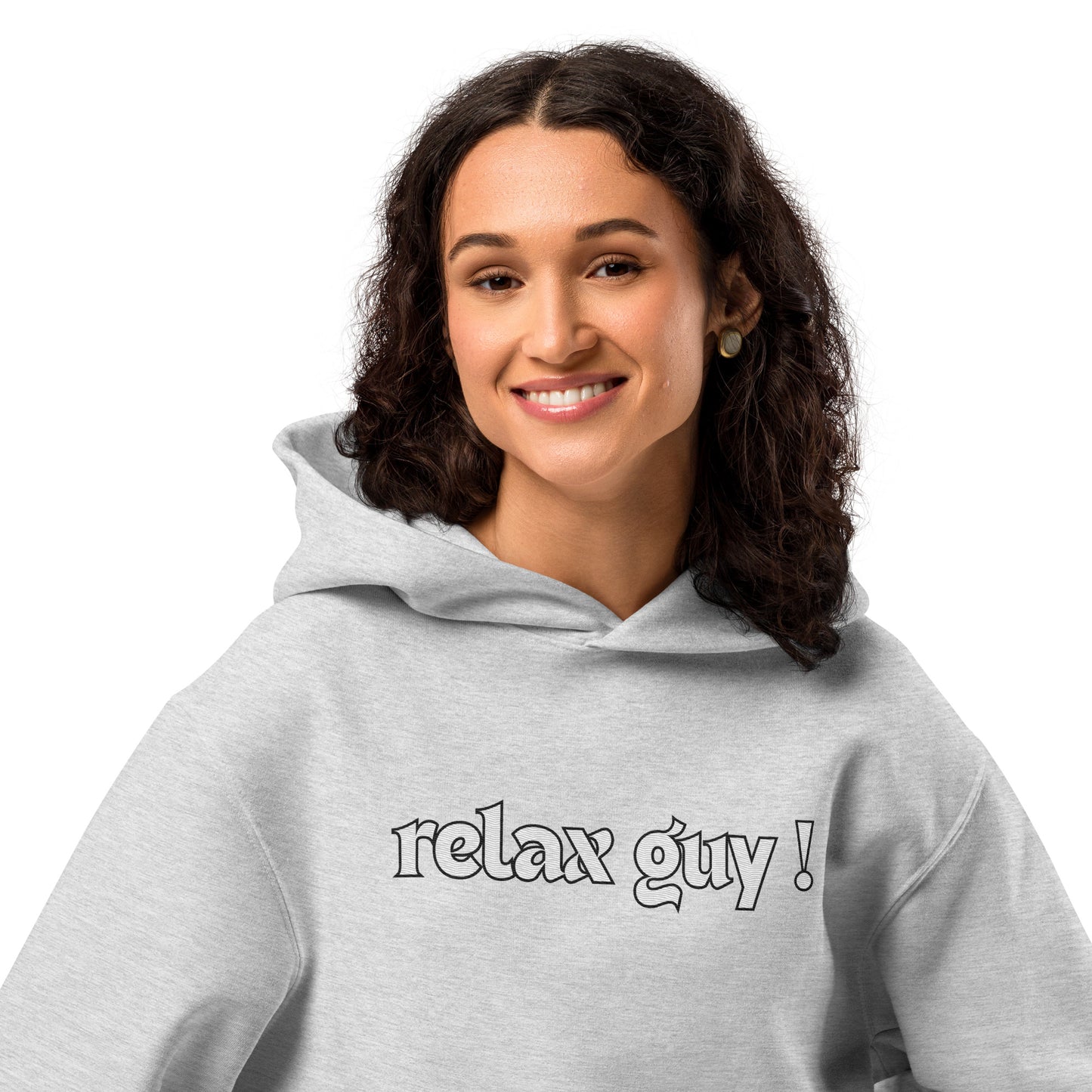 Close-up of smiling woman in gray hoodie showing "Relax Guy!" white text on chest