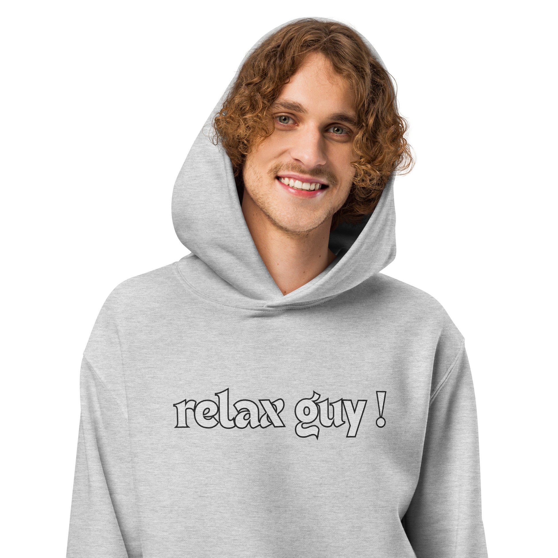 Curly-haired guy grinning in gray oversized hoodie with "Relax Guy!" front text