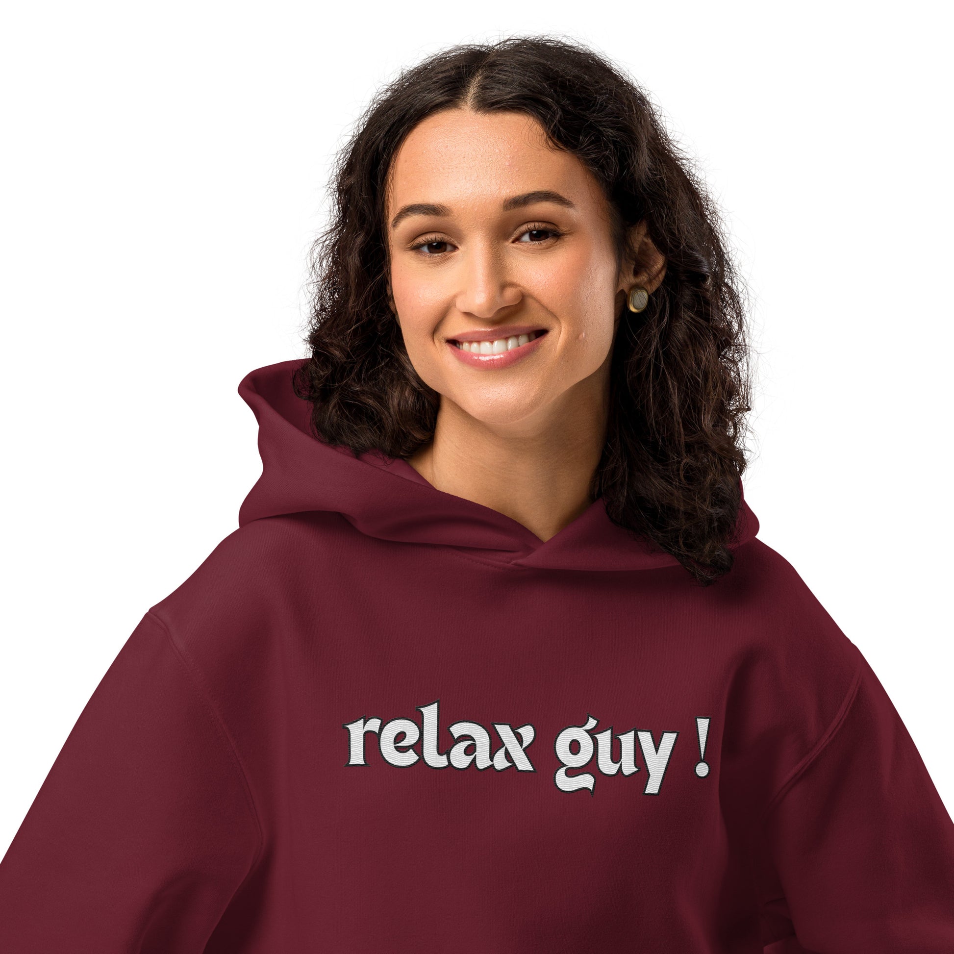 Smiling woman modeling maroon oversized "relax guy !" hoodie, front view
