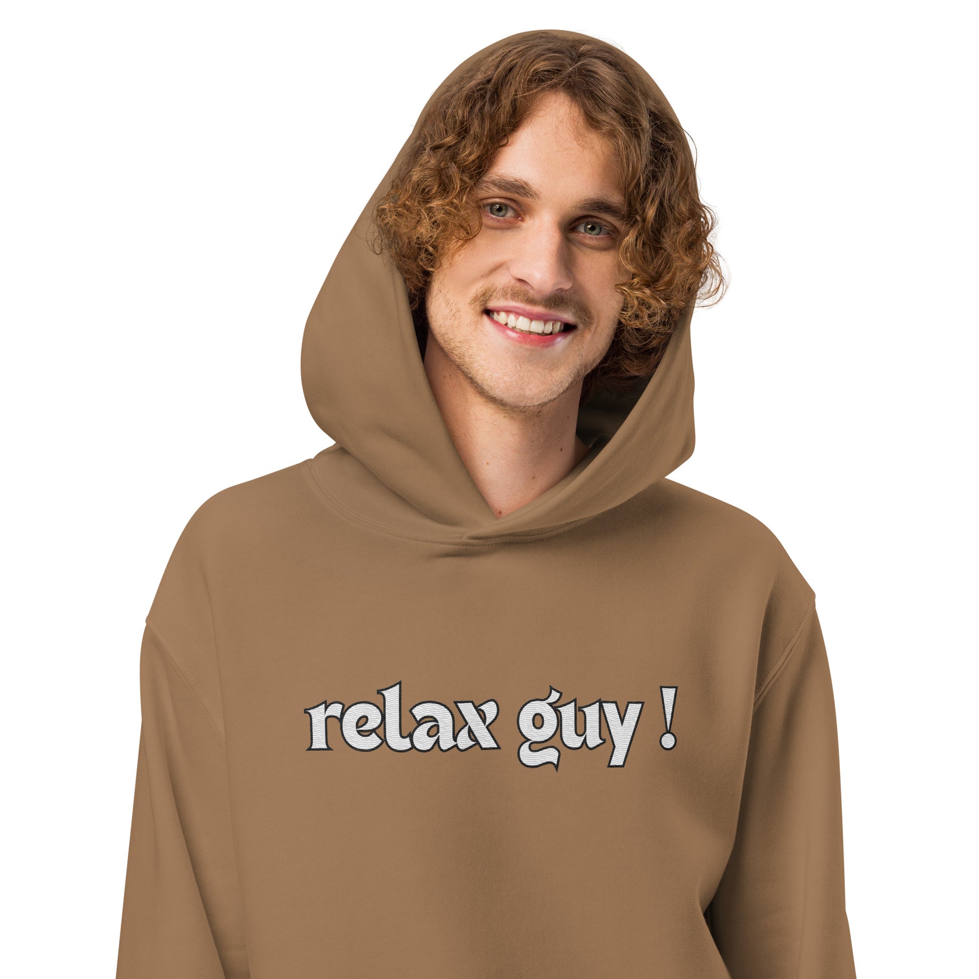 Man smiling in vintage brown oversized hoodie, "relax guy!" white chest print
