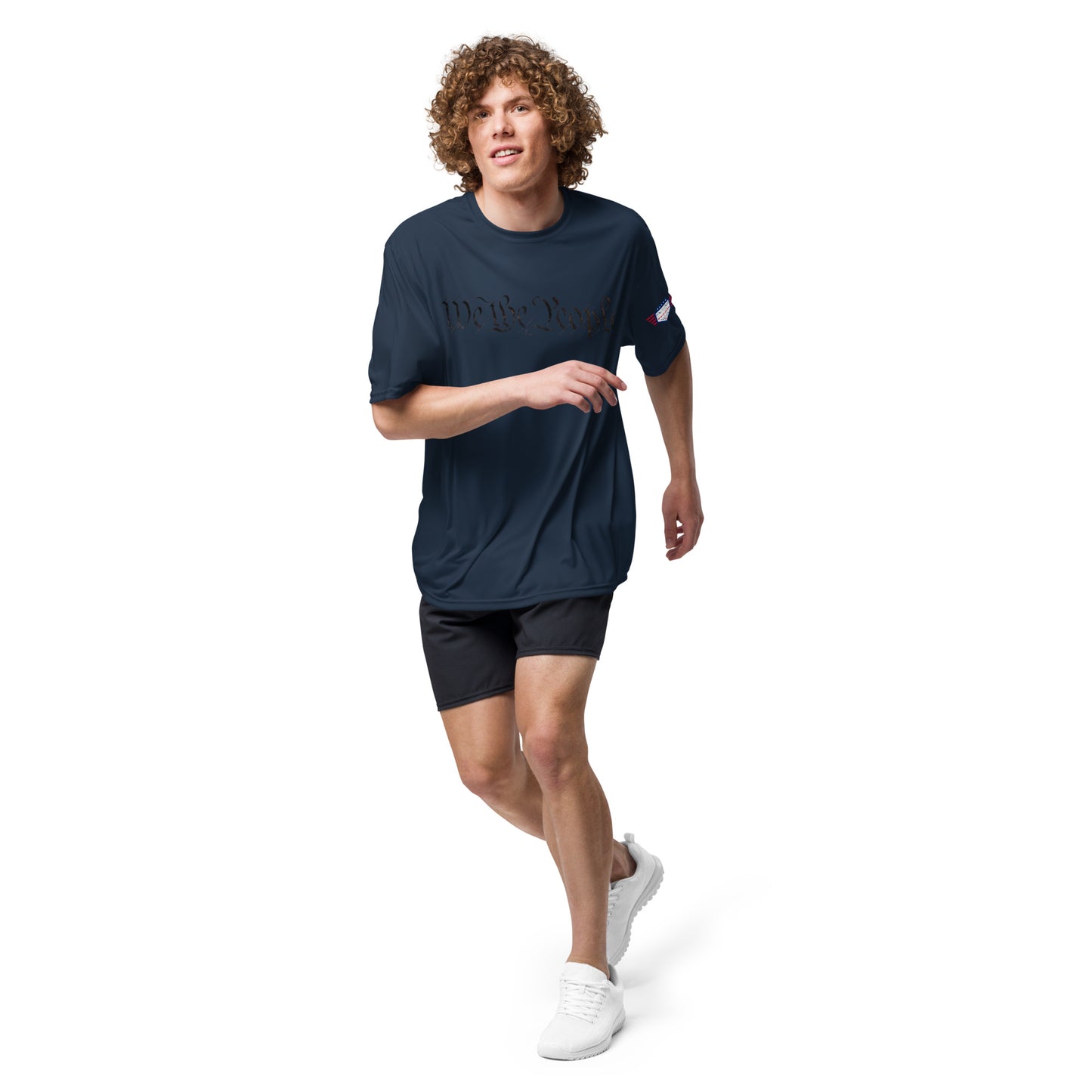 Guy mid-run in navy "We The People" performance tee, flag sleeve, shorts and white kicks