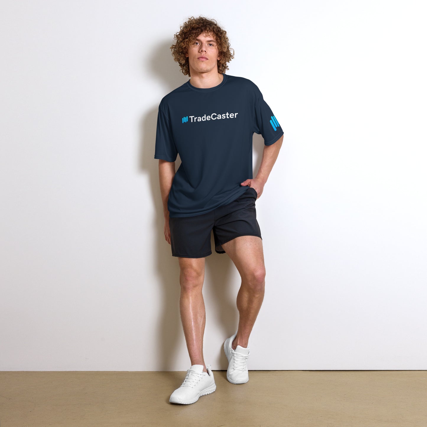 Model vibes in navy TradeCaster crew neck with cyan-white logo, shorts and kicks complete