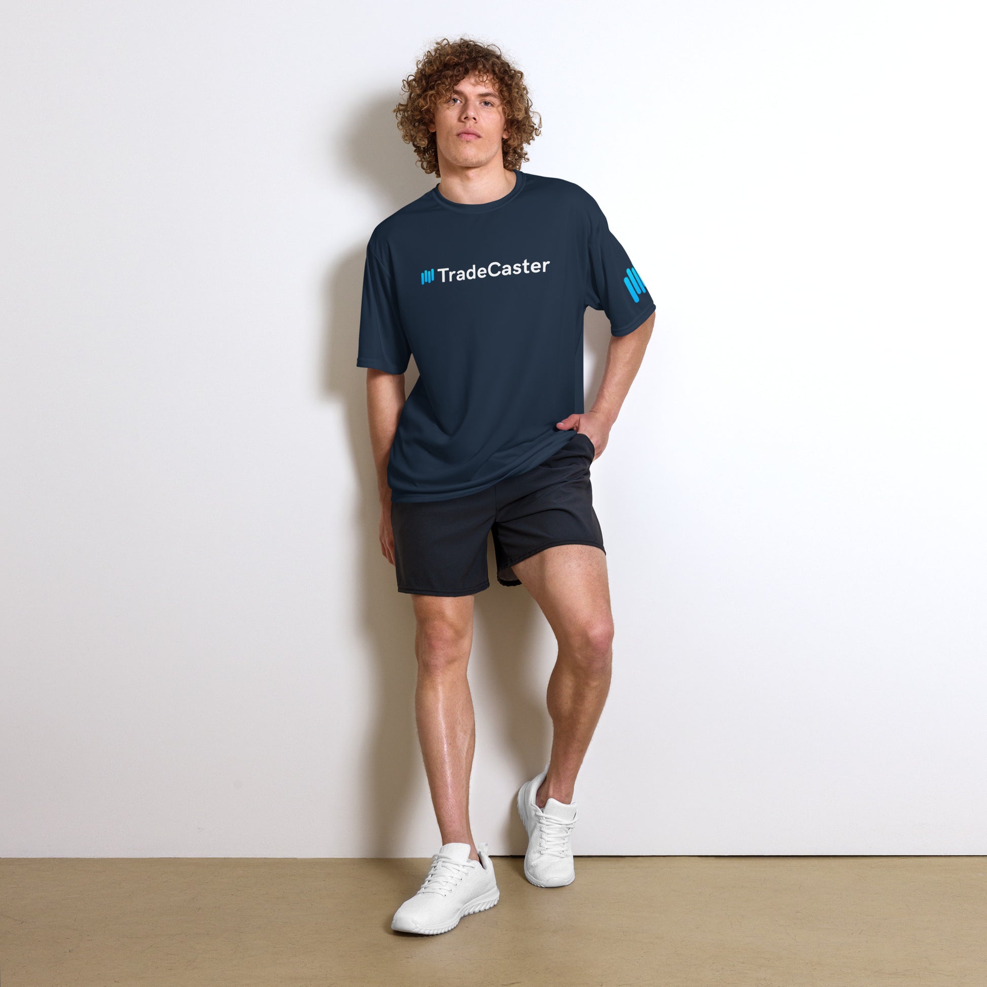 Model vibes in navy TradeCaster crew neck with cyan-white logo, shorts and kicks complete