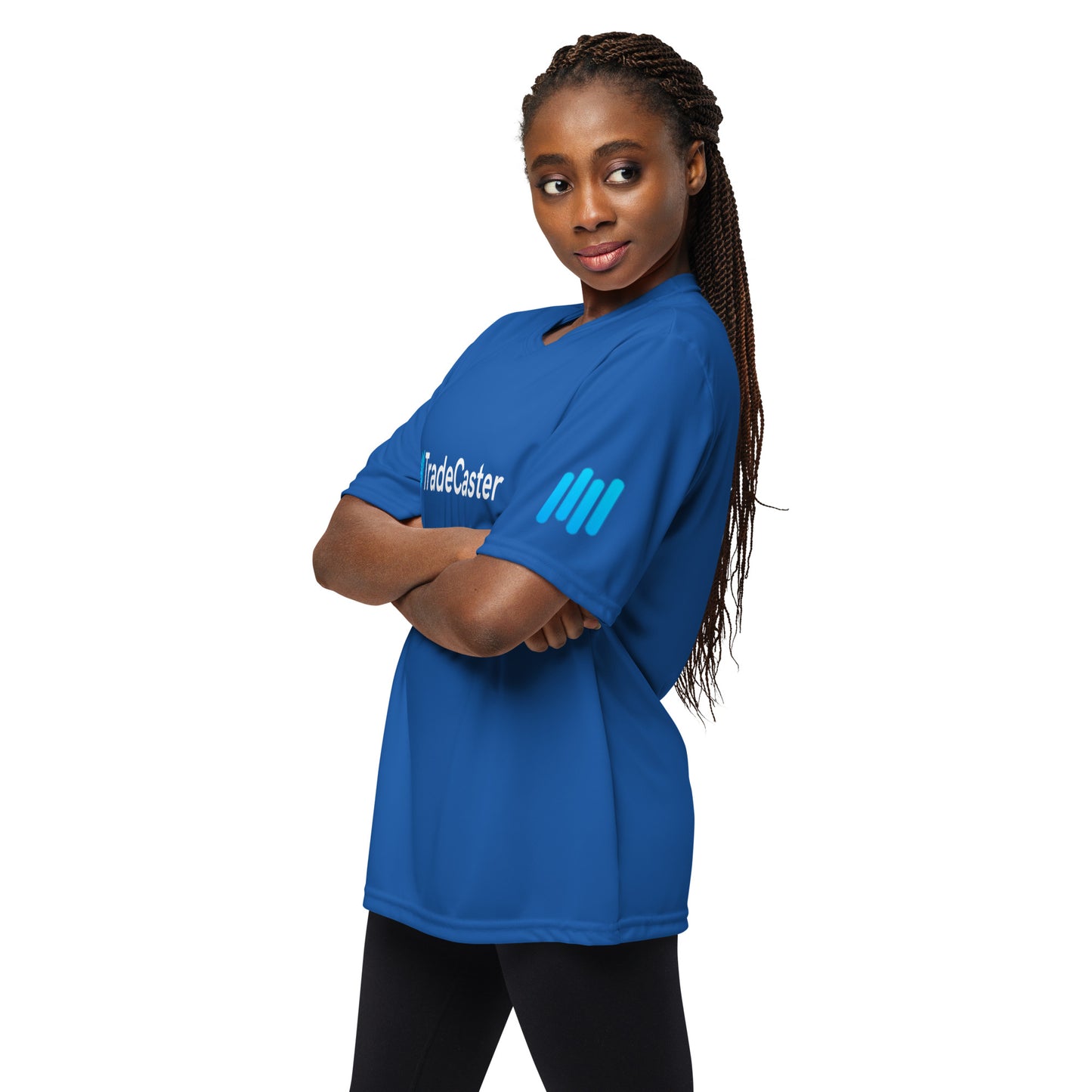 Side angle braided model in royal blue tee, arms crossed over cyan TradeCaster sleeve patch