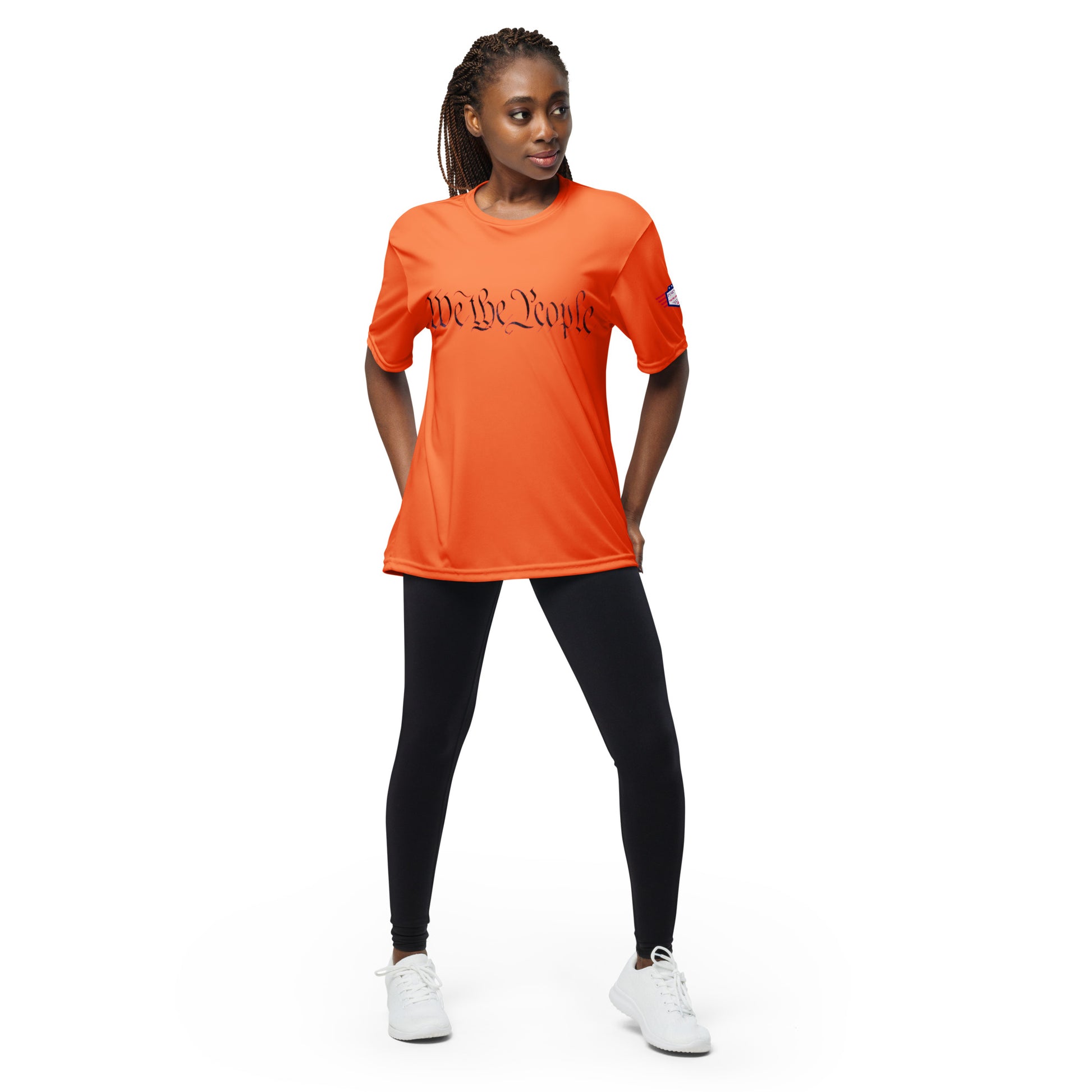 Woman in bright orange "We The People" crew neck tee, bold cursive patriotism