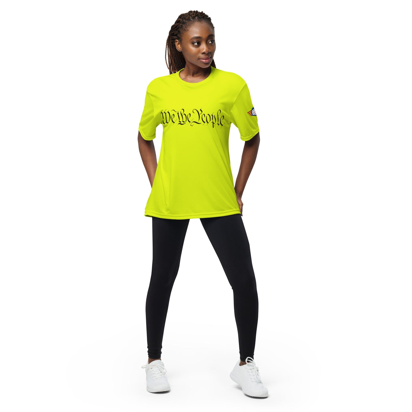 Woman modeling front of lime green performance tee with black "We The People" script and flag sleeve patch