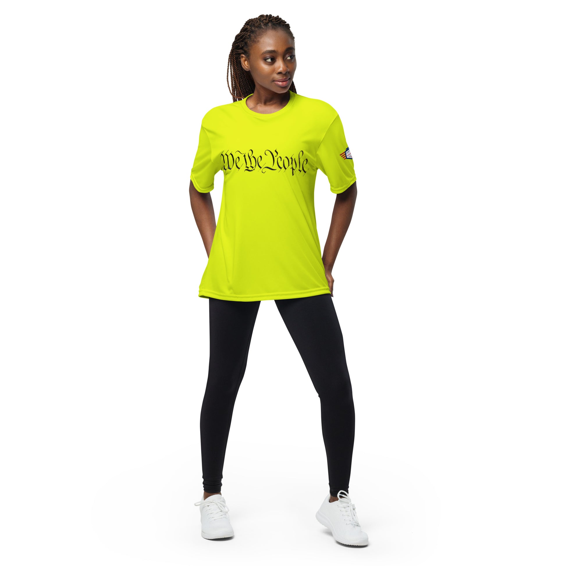 Woman modeling front of lime green performance tee with black "We The People" script and flag sleeve patch