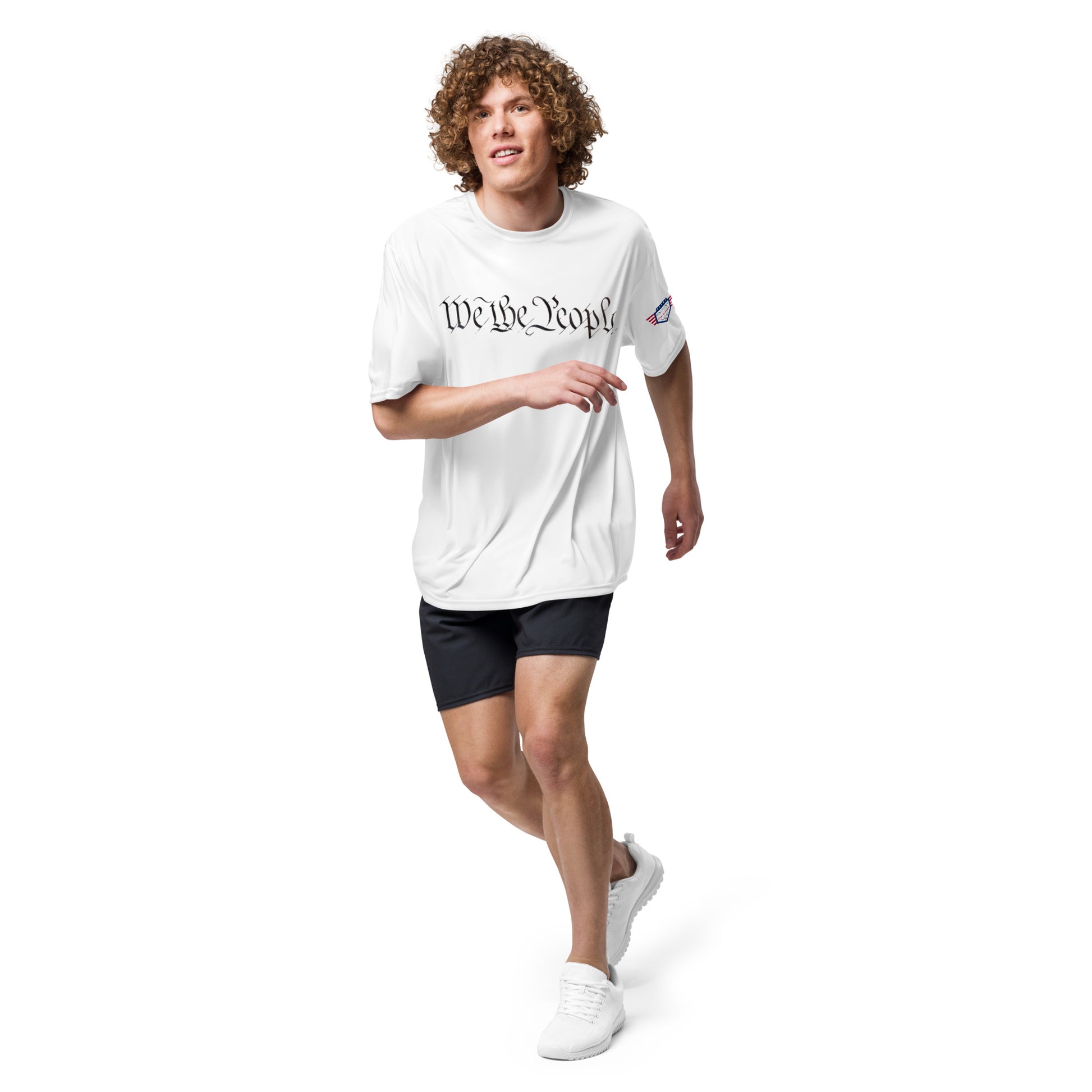 Dude mid-stride in white performance crew tee with "We The People," ready to roll