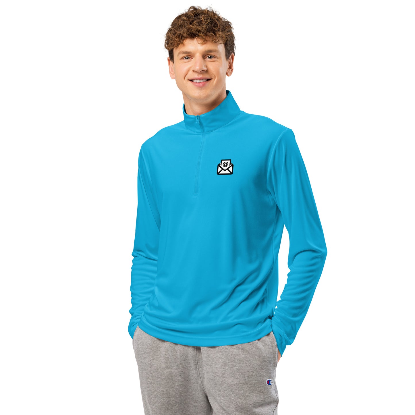 Dude in vibrant blue quarter-zip pullover, envelope icon popping on chest