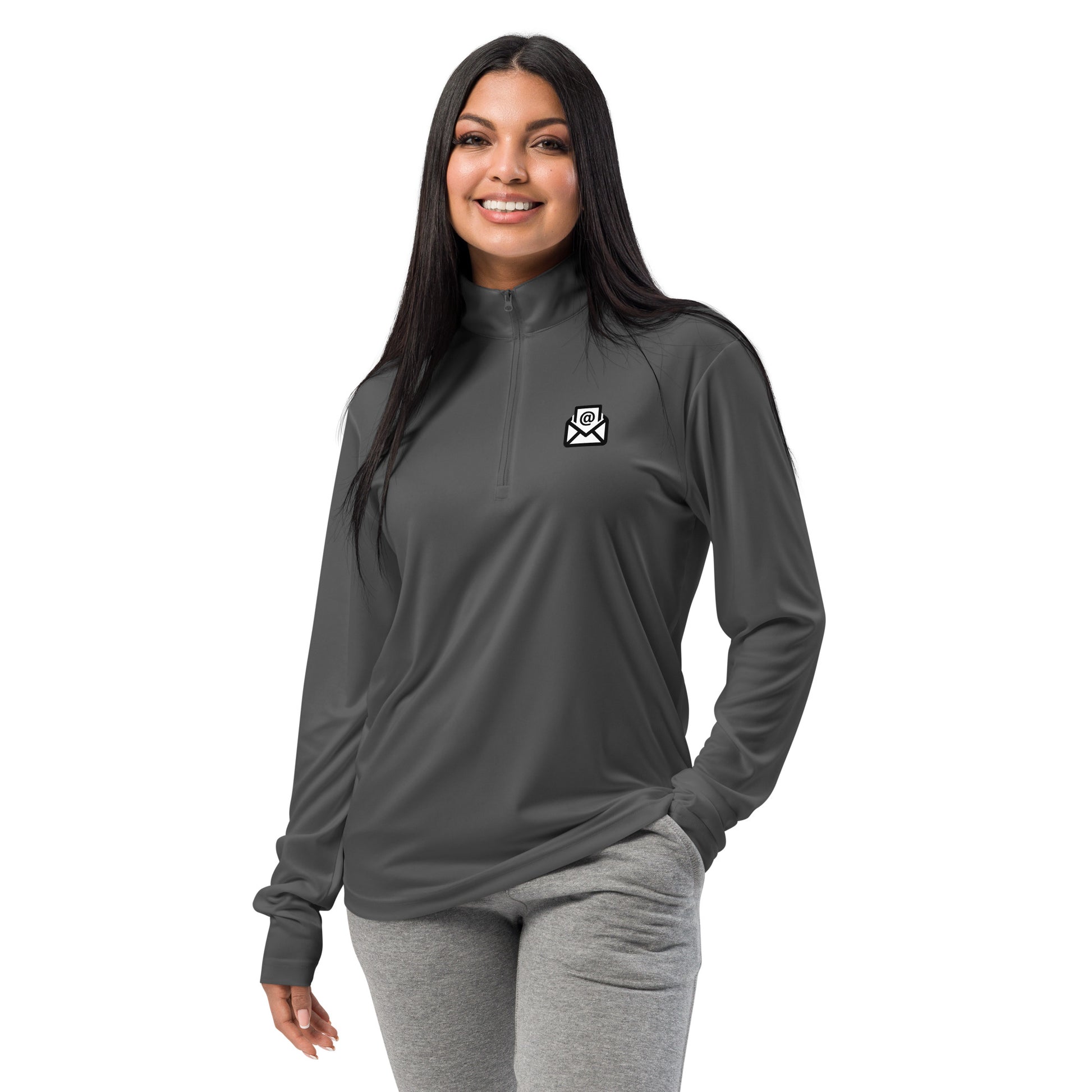 Smiling woman modeling navy quarter-zip pullover with white email envelope icon on chest, casual grey sweats