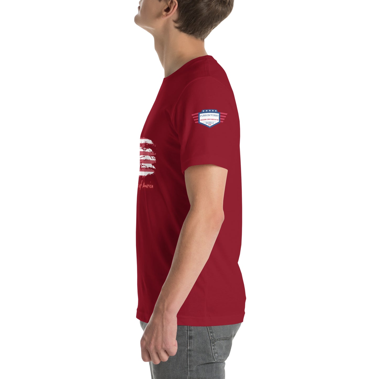 Right side view of model in red USA tee, subtle sleeve patch peeking, distressed flag edge visible