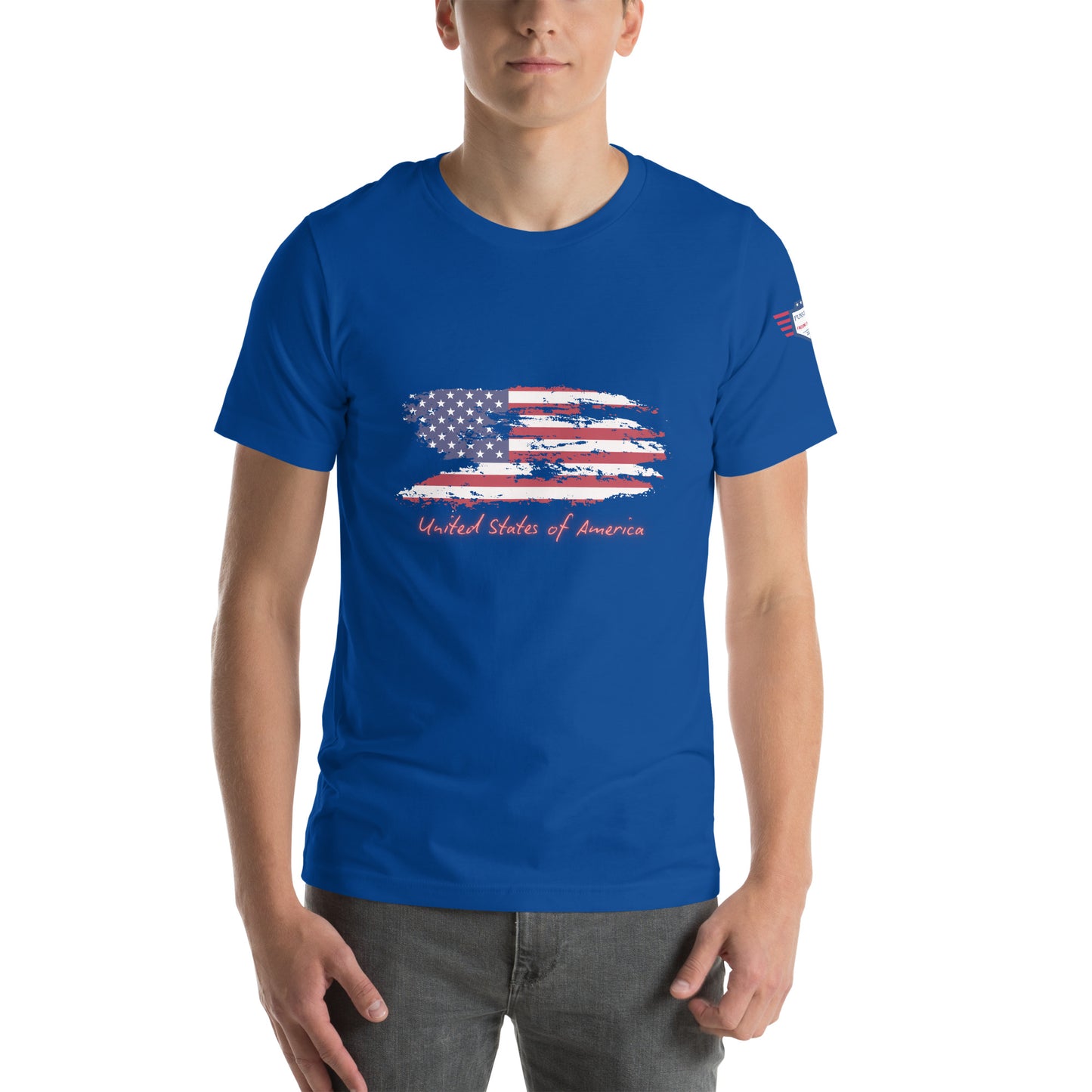 Back view of royal blue unisex t-shirt on model, clean with tiny sleeve flag emblem