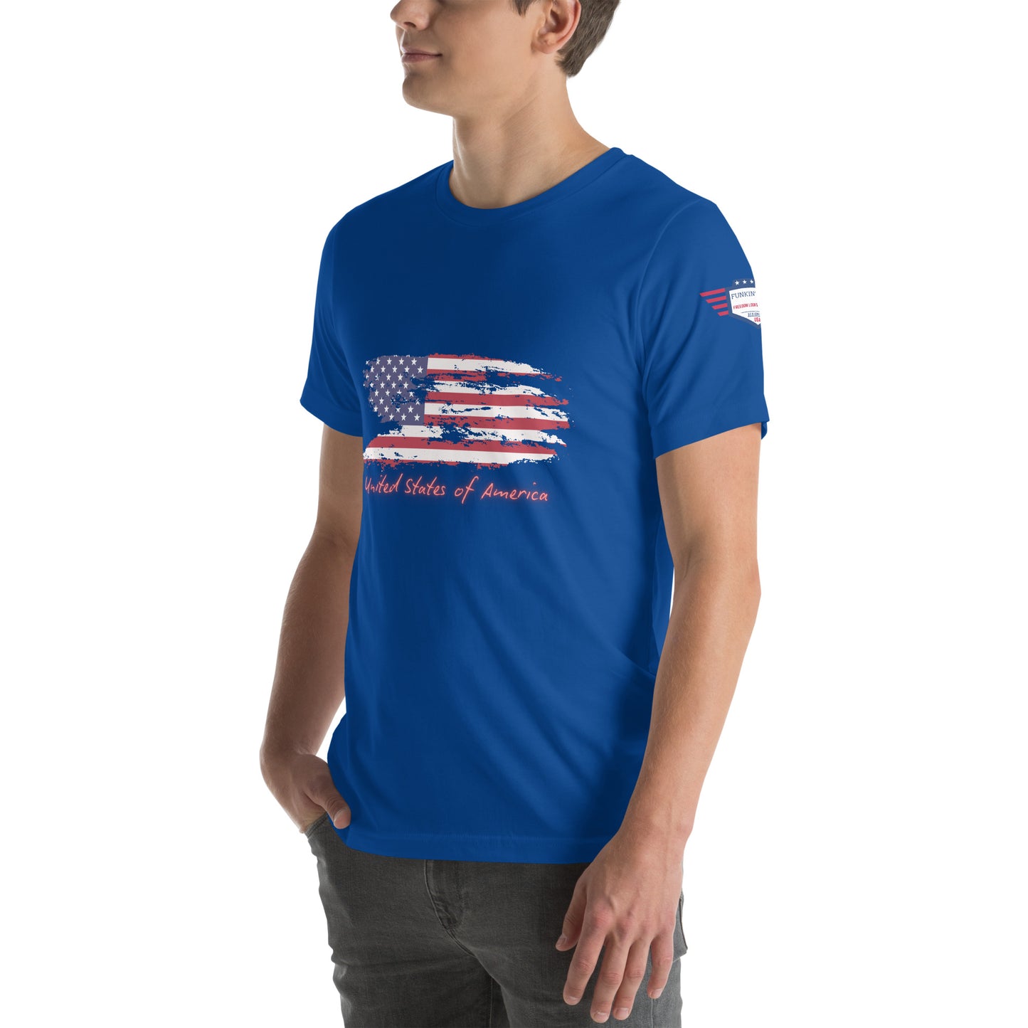 Slim profile side shot of model in royal blue unisex t-shirt, subtle flag edge visible