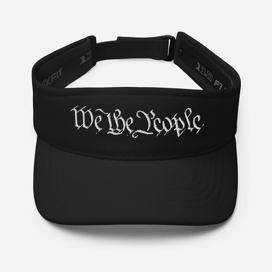 Front view of black low-profile visor with bold white "We The People" cursive embroidery across the crown
