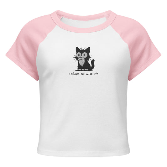 Front view of white raglan baby tee with pink sleeves, embroidered black shocked cat and "Lesbians Eat What ?!?" text