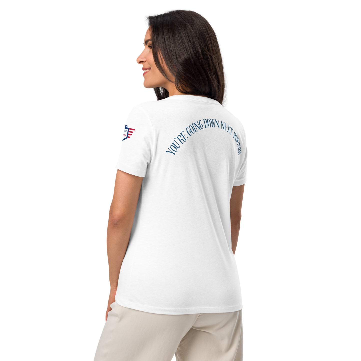 Back view of model in white Bunco Babes v-neck tee, navy "YOU'RE GOING DOWN BITCH" arched at hem with flag patch on shoulder