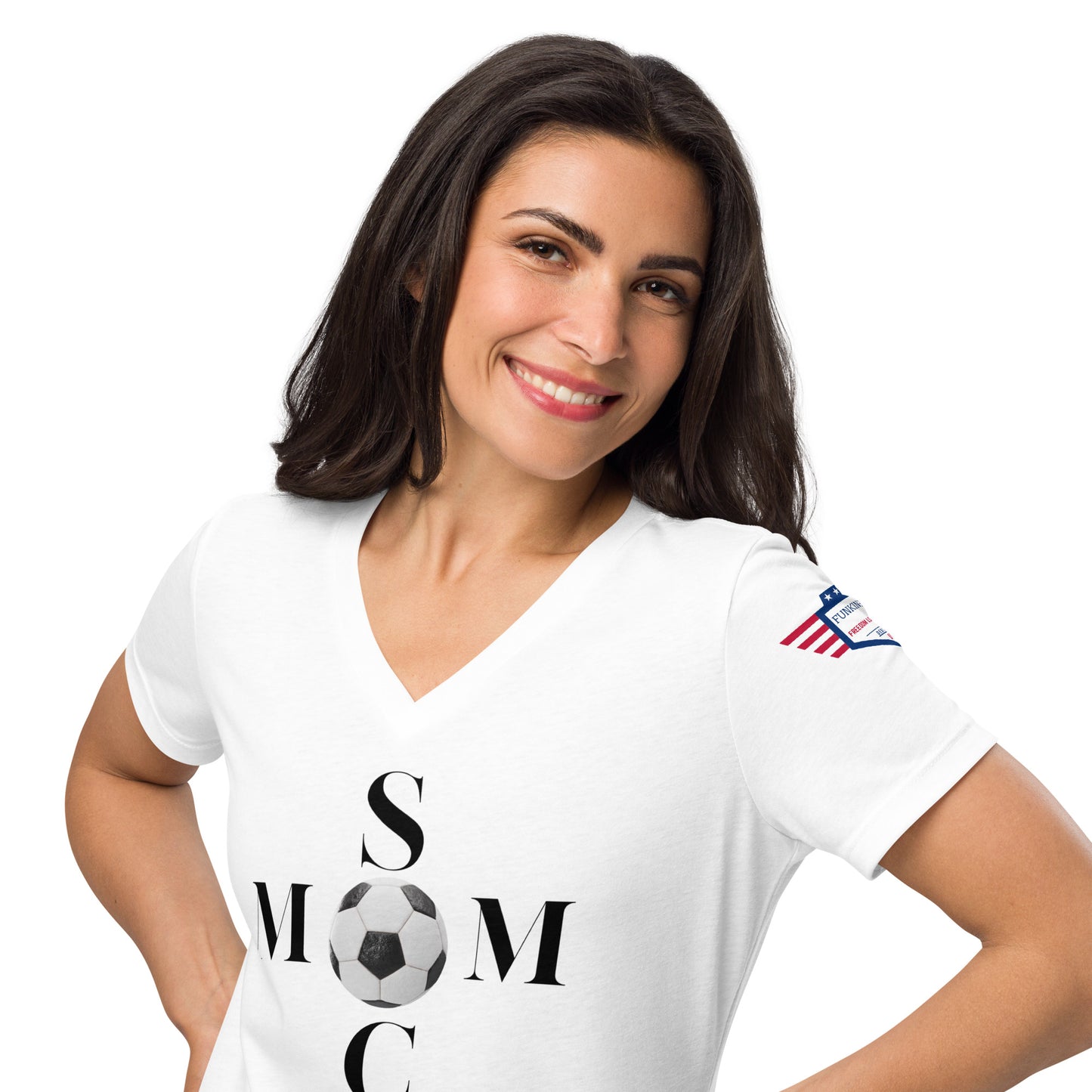 Smiling brunette model owning white 'Soccer Mom' v-neck tee front pose, hands on hips